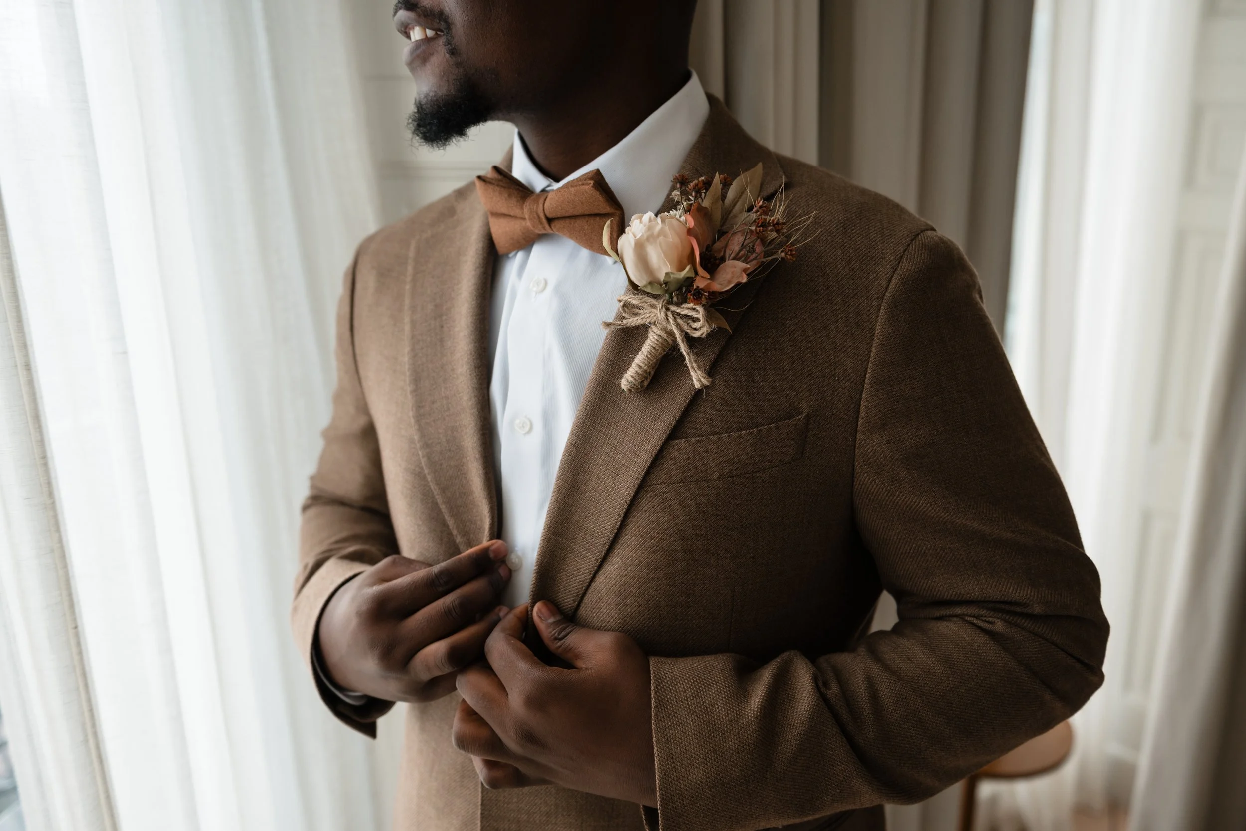 groom in brown wool jacket with bowtie