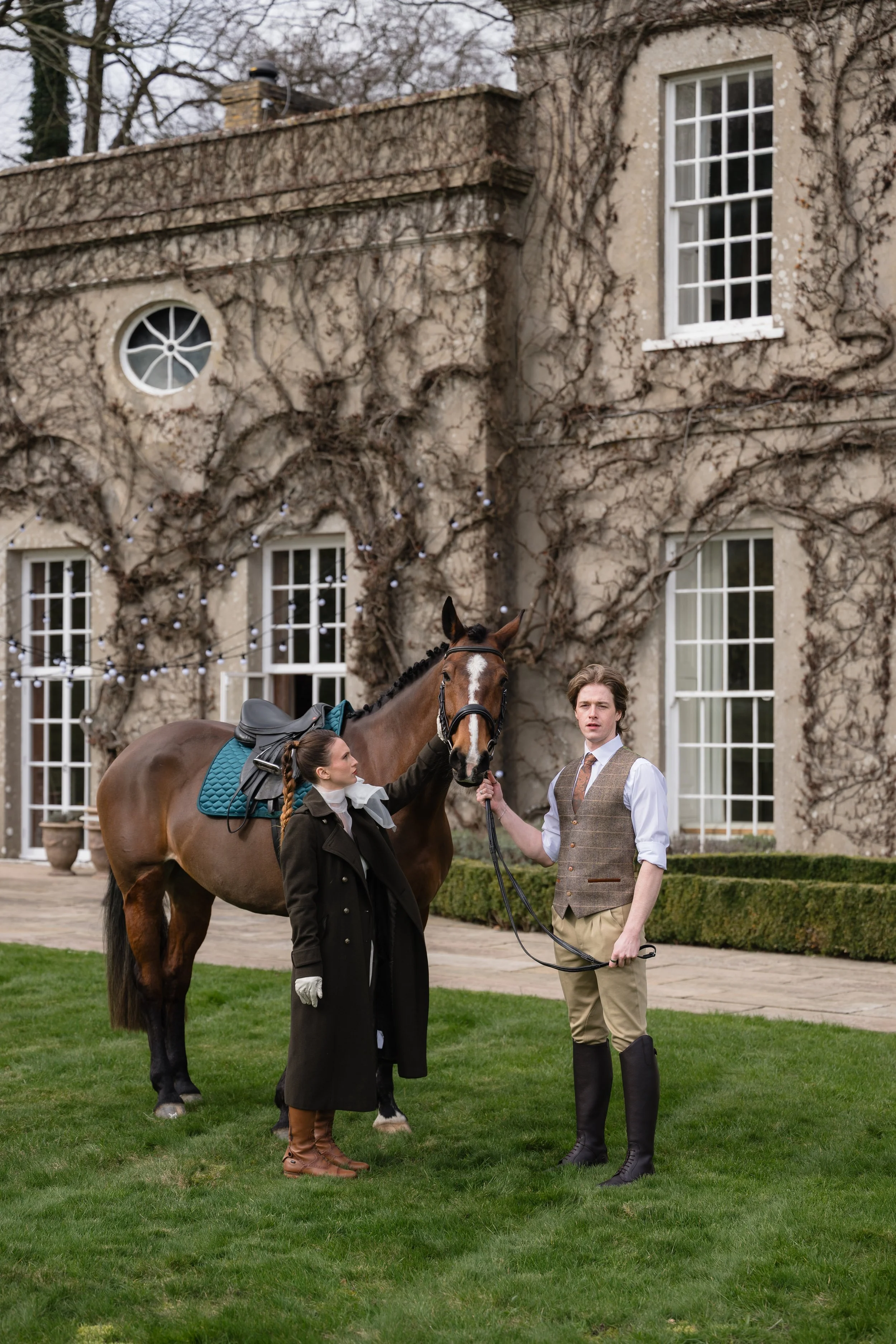 bride and groom with horse at Sussex country house