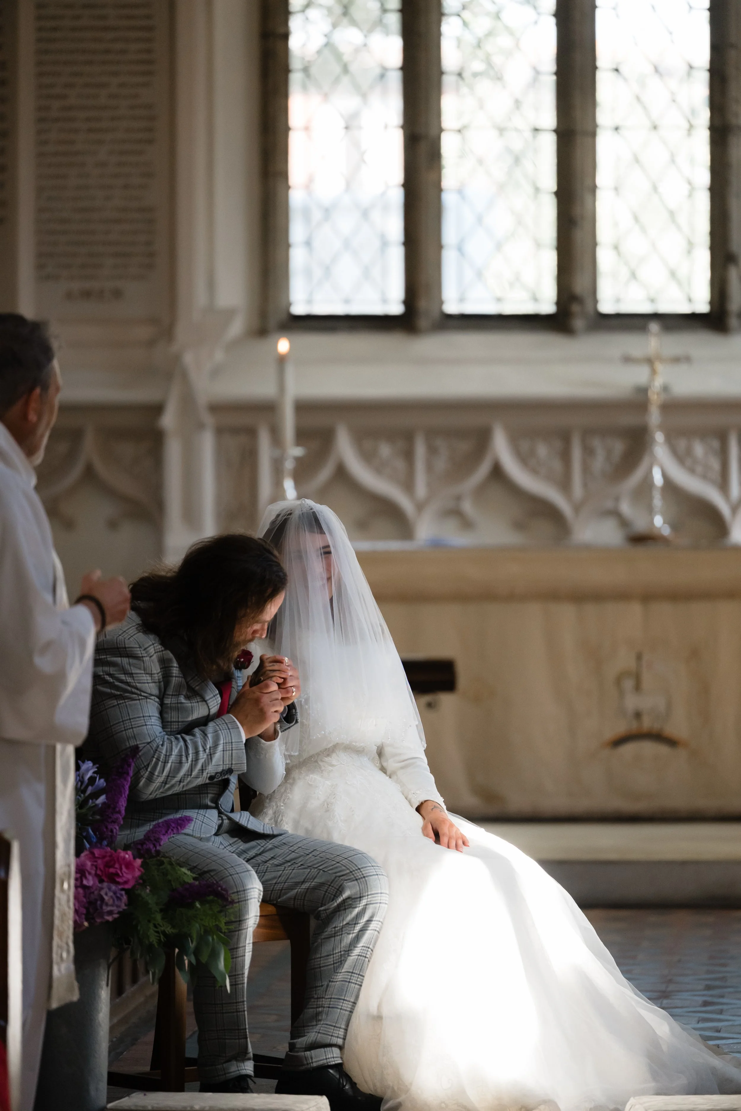 Bride and groom in a candlelit church