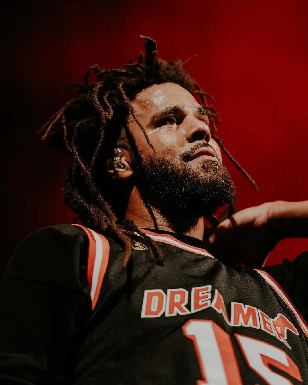 throwback to when J. Cole wore Dreamville x Mitchell & Ness jerseys to every city he performed i-9.jpg