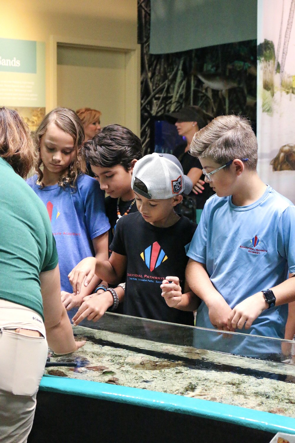 Students enjoy touch tank on field trip at Conservancy of Southwest Florida - Educational Pathways Academy, private school for dyslexia in florida.jpeg