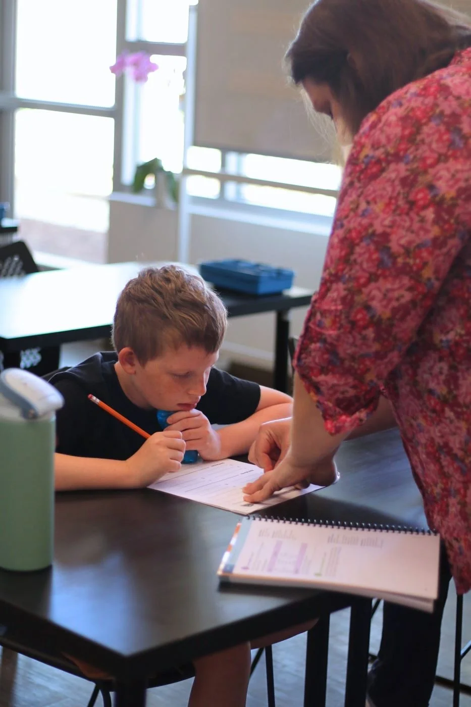 Teacher helps Student with learning differences in syllabication lesson in Orton-Gillingham class at Educational Pathways Academy, a private school for dyslexia and learning disabilities in Florida.jpg