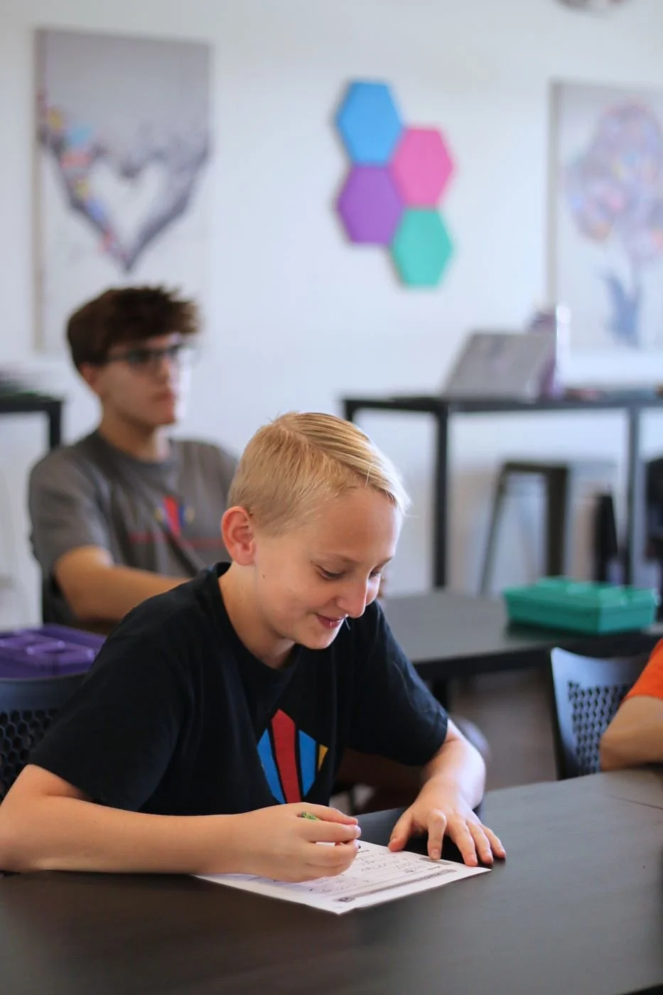 Student with learning differences succeeds in syllabication lesson in Orton-Gillingham class at Educational Pathways Academy, a private school for dyslexia and learning disabilities in Florida.jpg