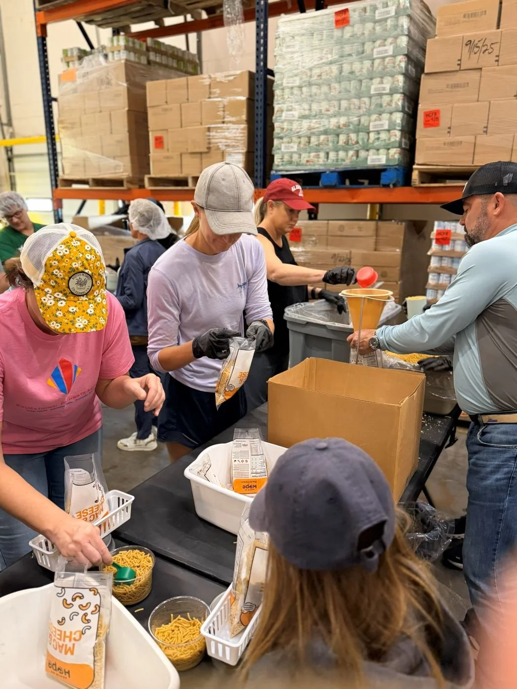 families-packing-meals-of-hope-educational-pathways-academy-.jpg