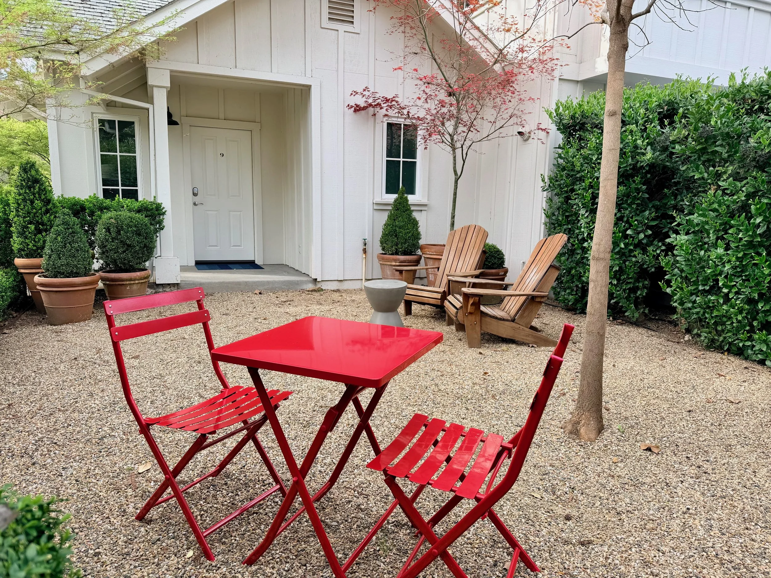 Bistro set & Adirondack Chairs in Private Courtyard for Private Cottage unit.
