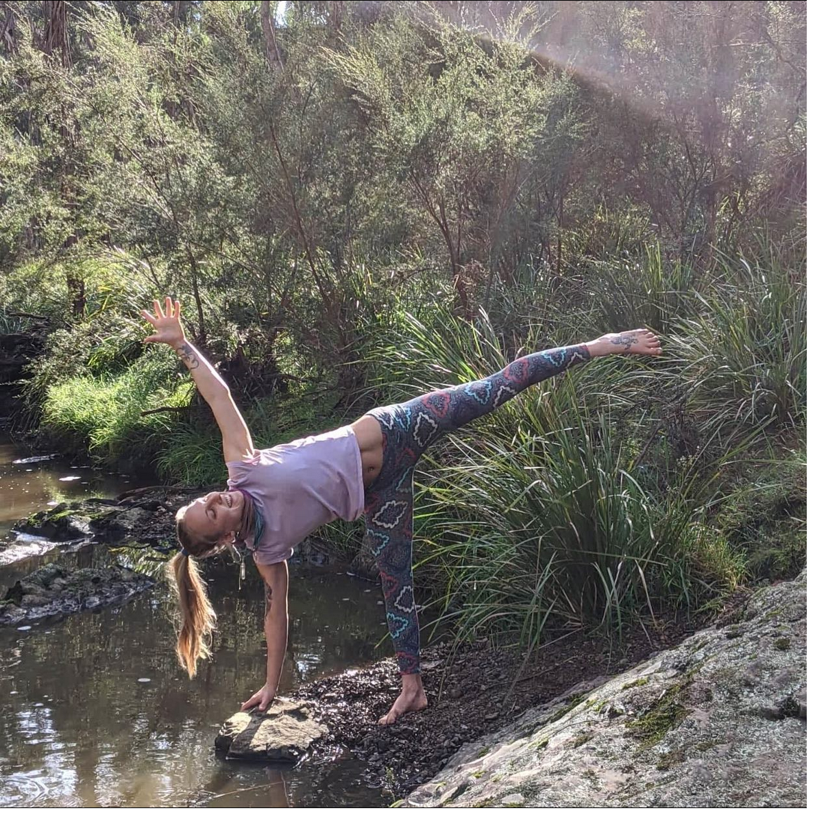 Molly Rose practising yoga outdoors connecting breath, body and awareness.