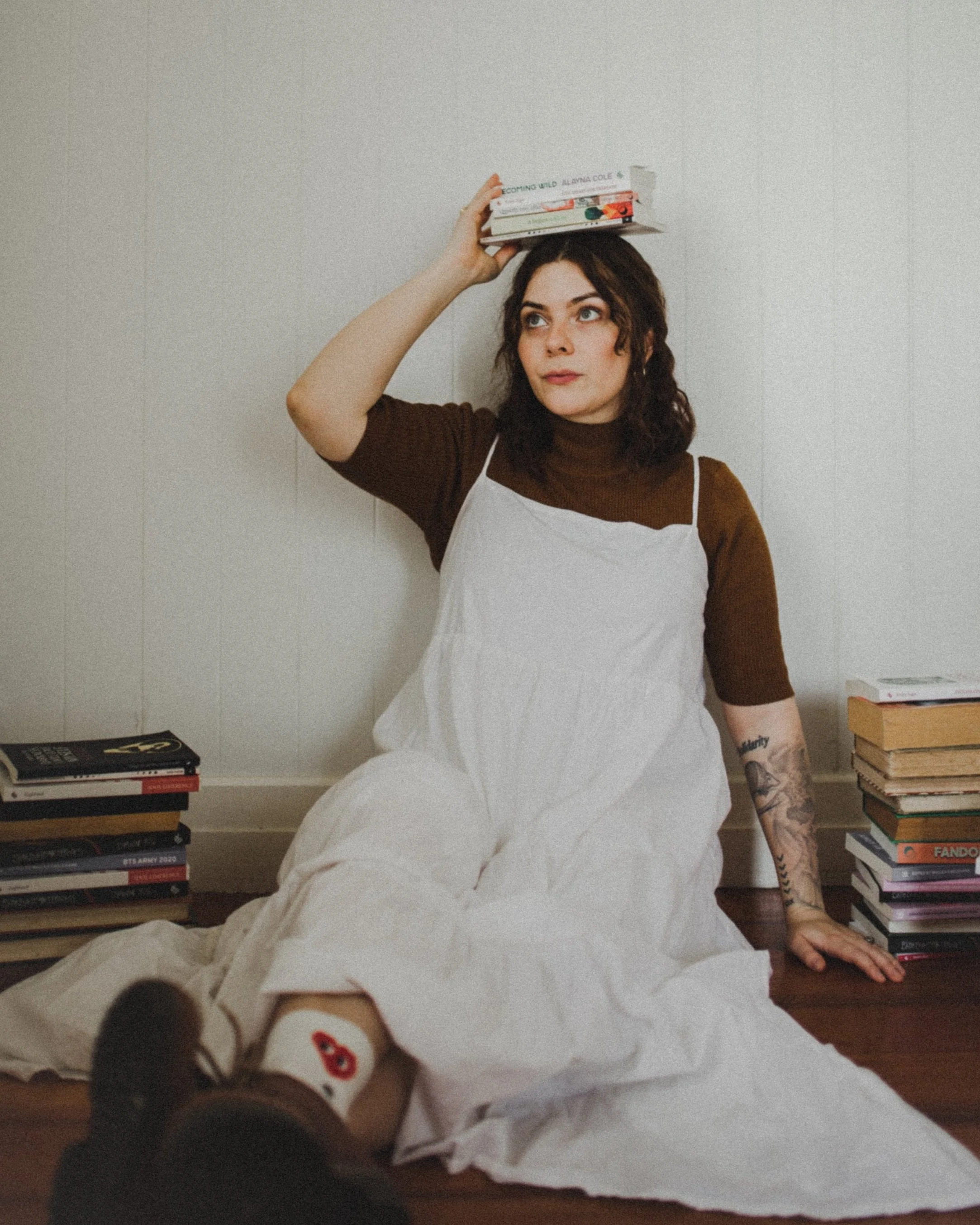 Wallea with books on her head
