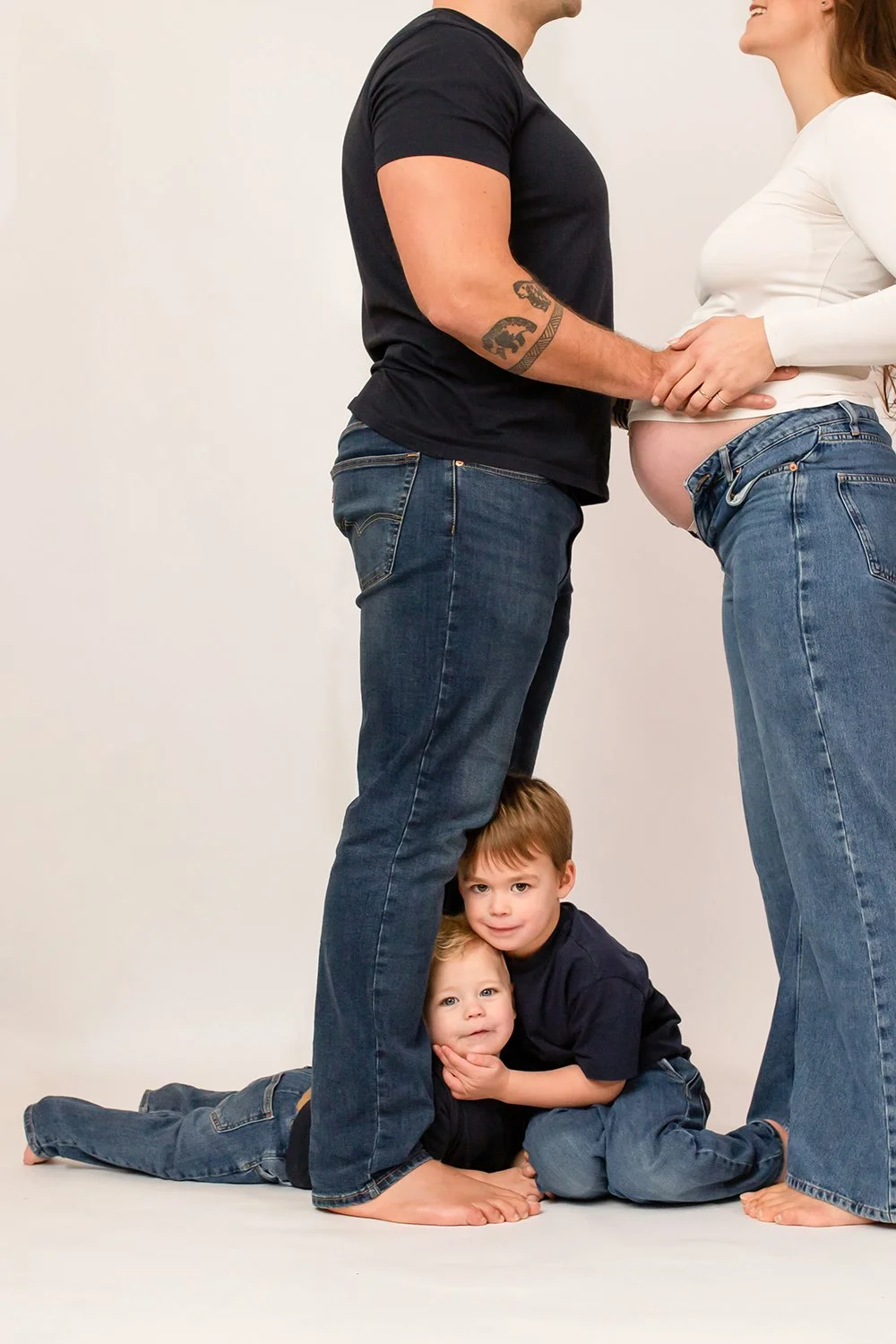 two toddlers hugging each other during a family and maternity photoshoot in Cheltenham