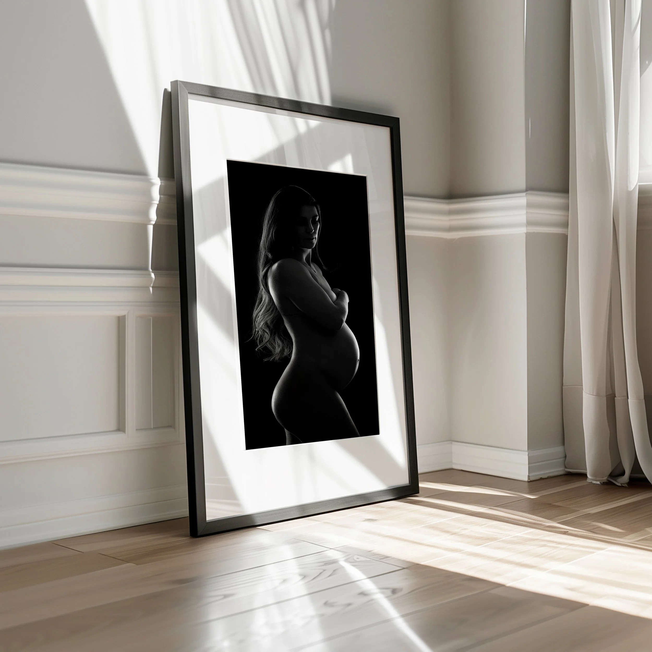black and white portrait of a pregnant woman framed in a Cheltenham photography studio