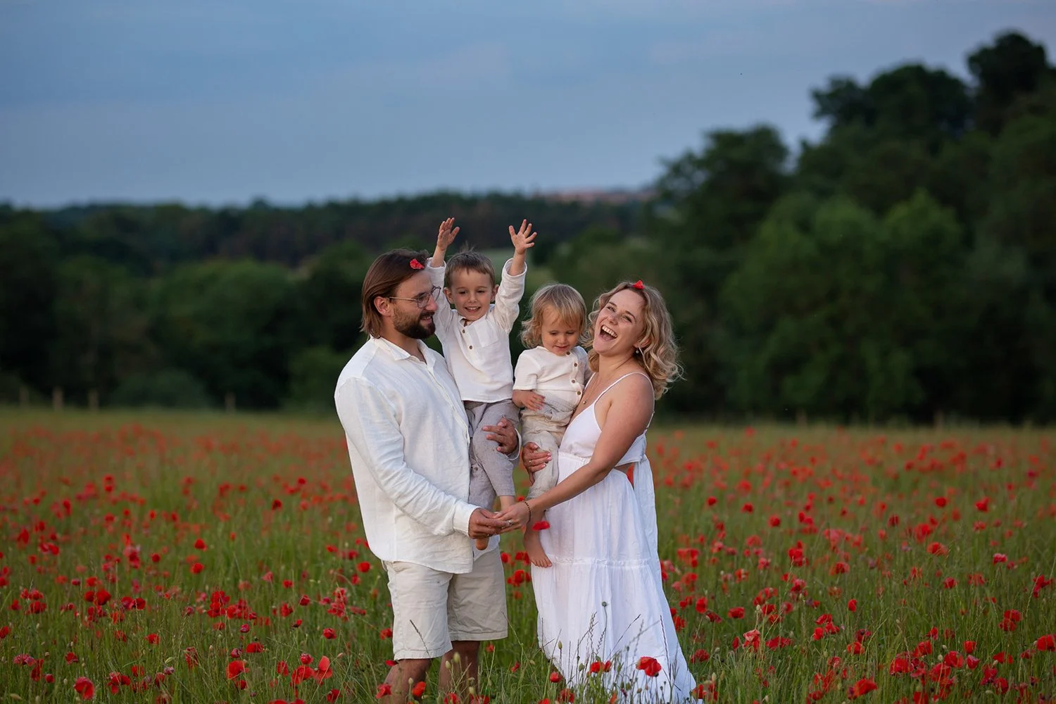 family having fun during an outdoor photoshoot in the Cotswolds