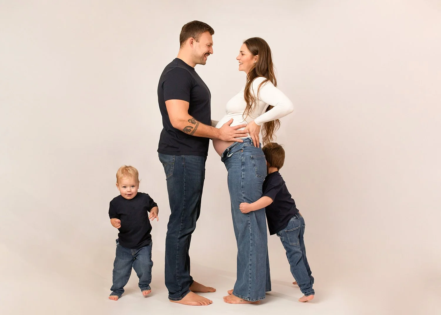 family having fun during a family and maternity photoshoot in Cheltenham photography studio