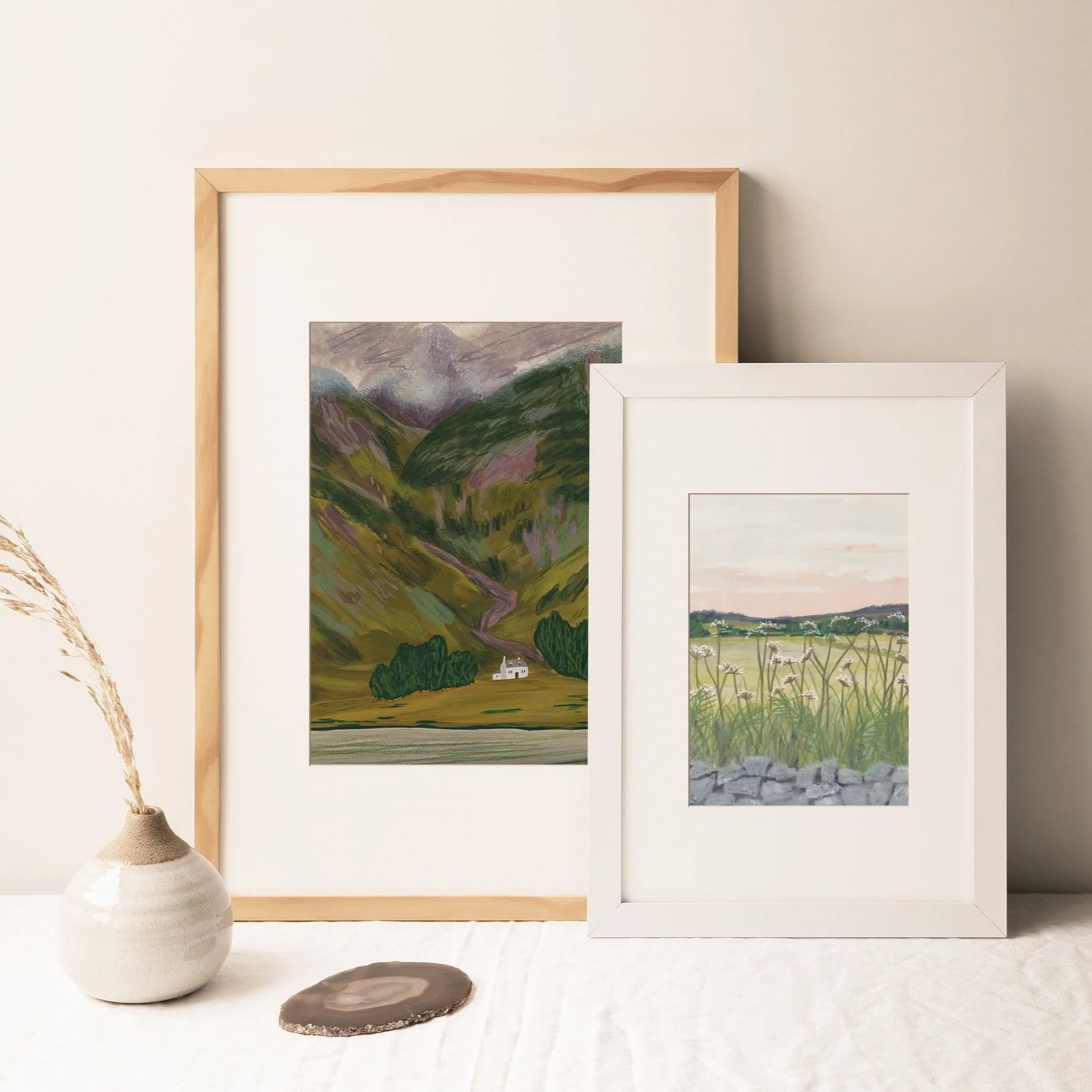 two framed landscape prints