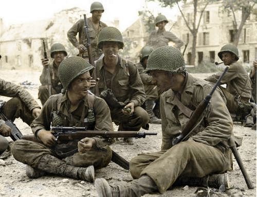 infantrymen-of-the-83rd-division-in-normandy-stop-for-a-chat-with-their-company-marksman-late-july-1944.jpg
