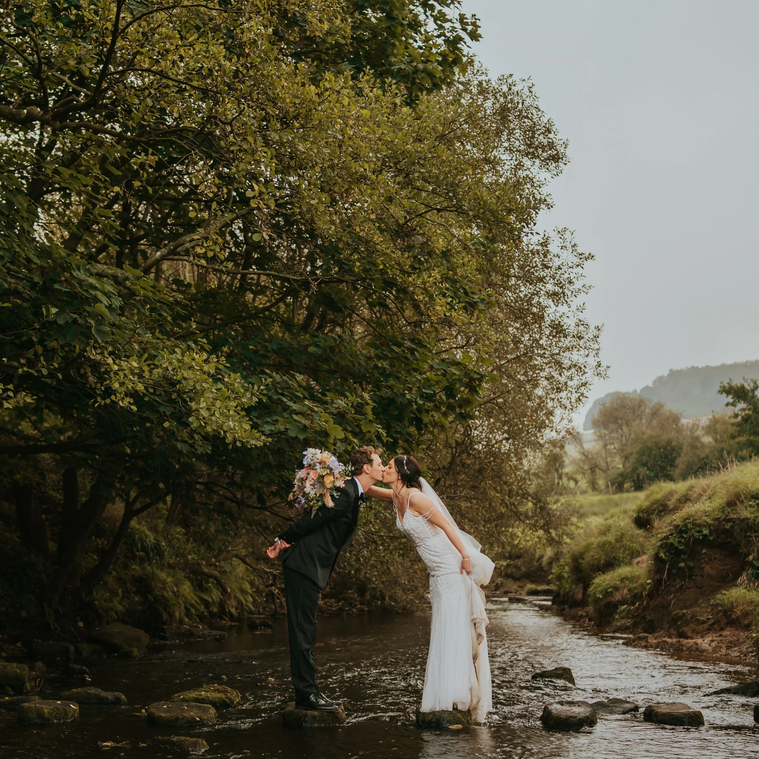 Danby-Castle-Barn-Wedding-photography-river-couple.jpg