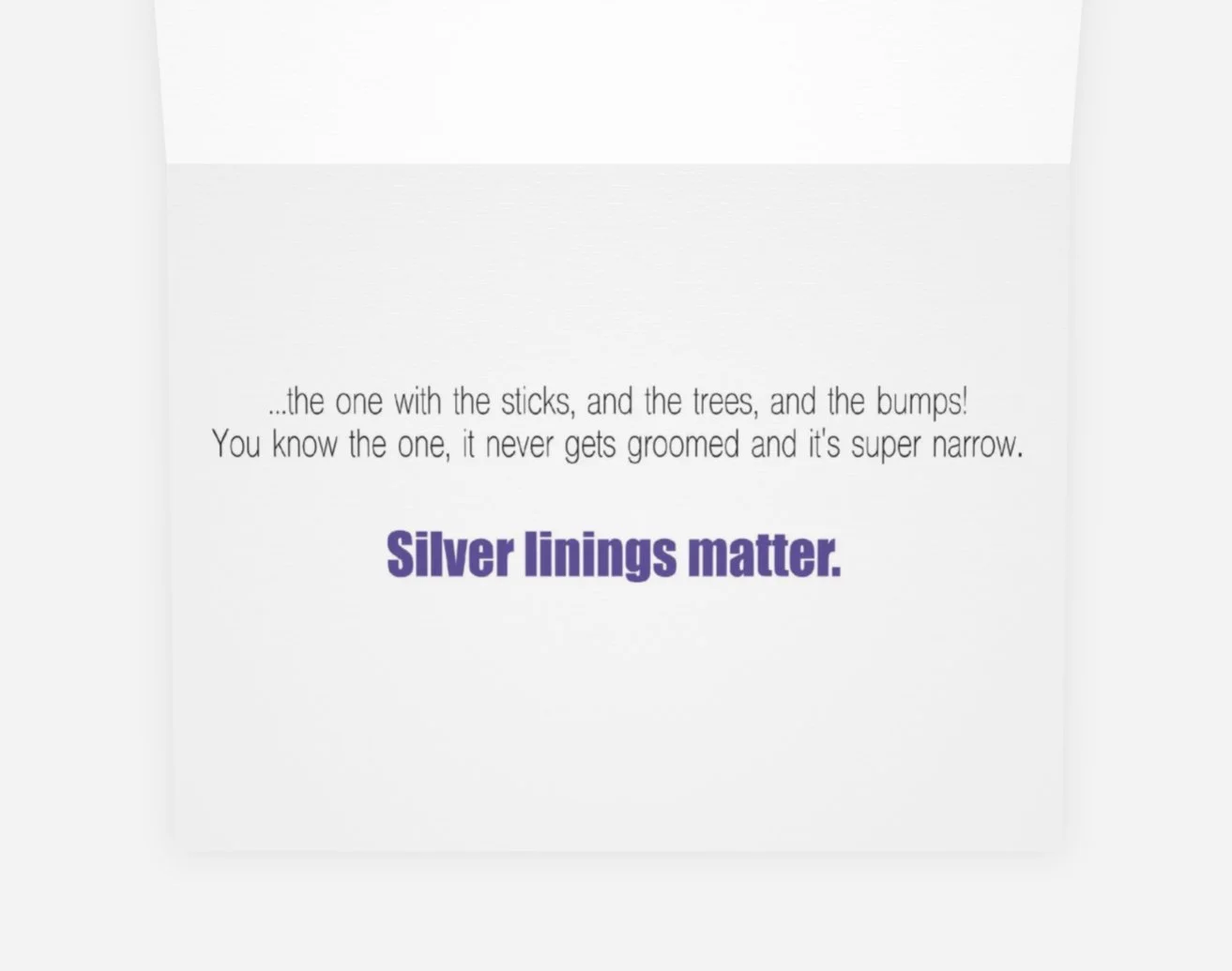 The "Pole Drop" card, in an open position, to show the inside with the written message.