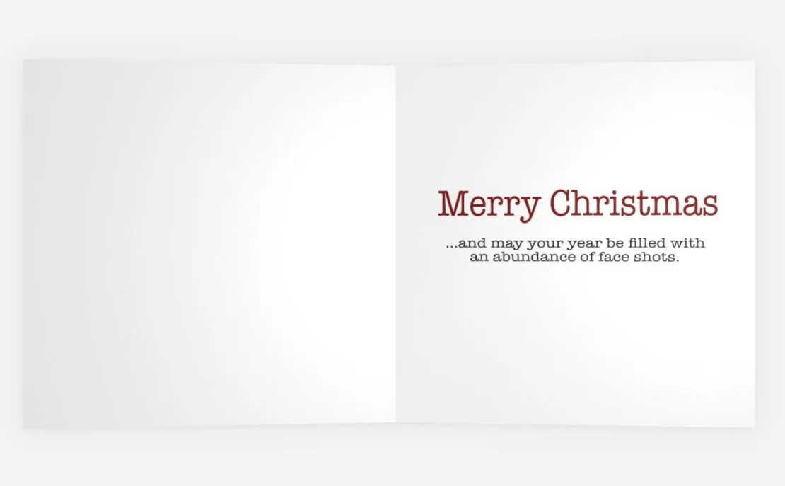 The "Sleigh the Glades" card, opened, showing the message on the inside: Merry Christmas, may your year be filled with an abundance of face shots.