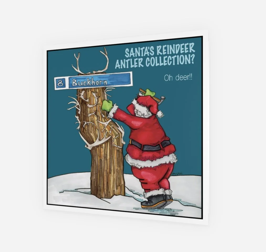 Front of the card has Santa nailing antlers to the popular Buckhorn sign at the Kimberley Alpine Resort.