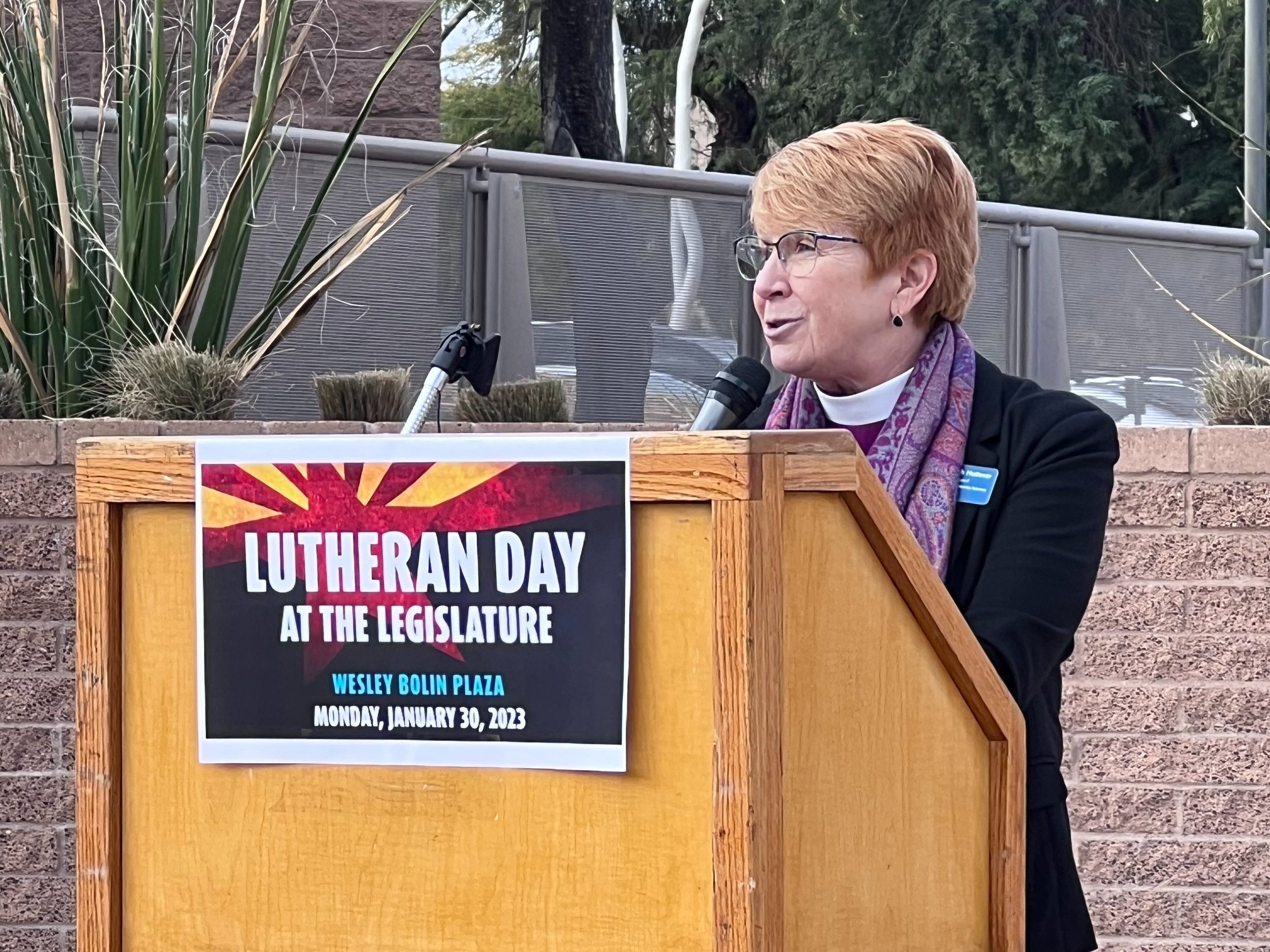  Bishop Deborah Hutterer leads the opening devotion. “We are gathered and united today at Wesley Bolin Plaza, and maybe we are surprised by our unity in this place at a time of deep polarization in our culture. But dear friends, the reality is this: 
