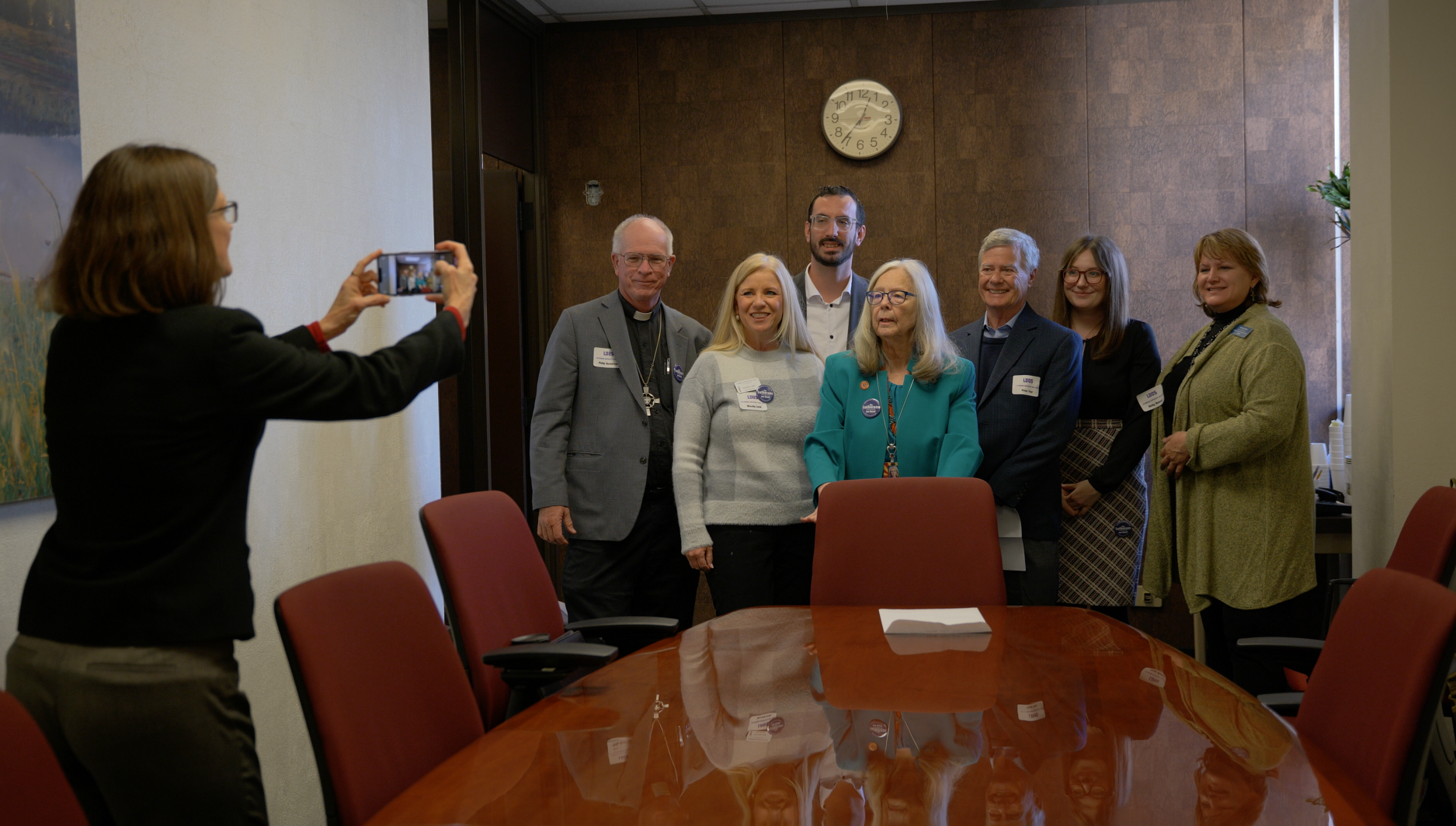  “Always take a picture for social media!” Connie Phillips says, while demonstrating the technique. Left to right: Connie Phillips, Pr. Phil Gustafson (Grace, Phoenix), Wendy Look (LSS-SW board member), Braden Biggs, Sen. Alston, Peter Faur (La Casa 