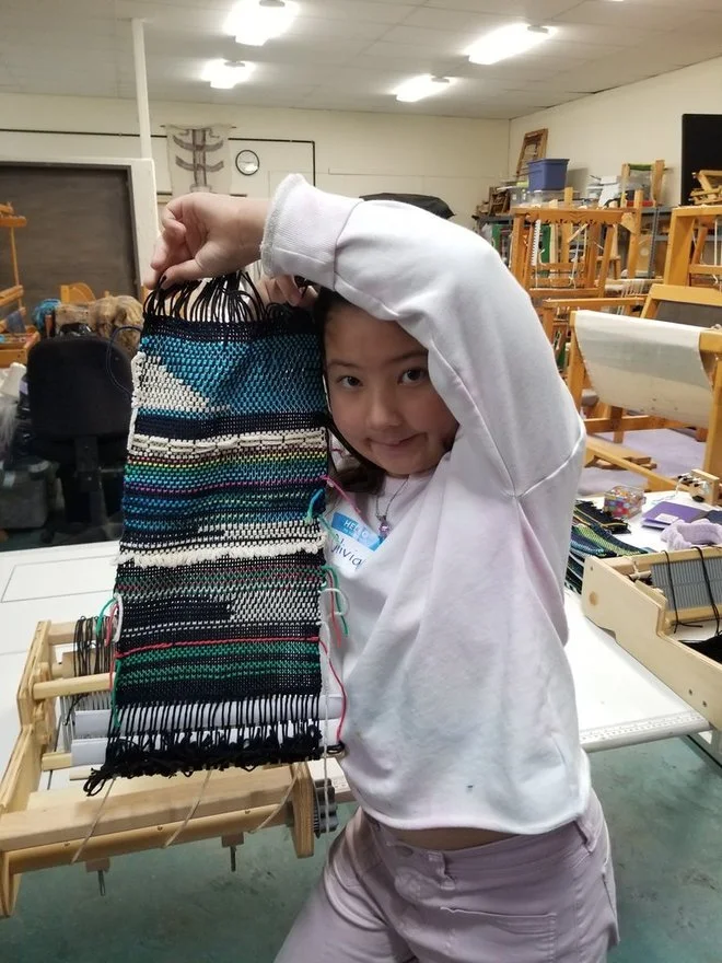 Olivia showing her weaving!.jpg