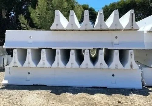 A stack of precast concrete barriers for distribution center security near Moreno Valley, CA.