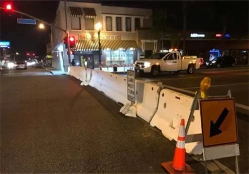 Davis K-Rail for event parking being set up on the street.