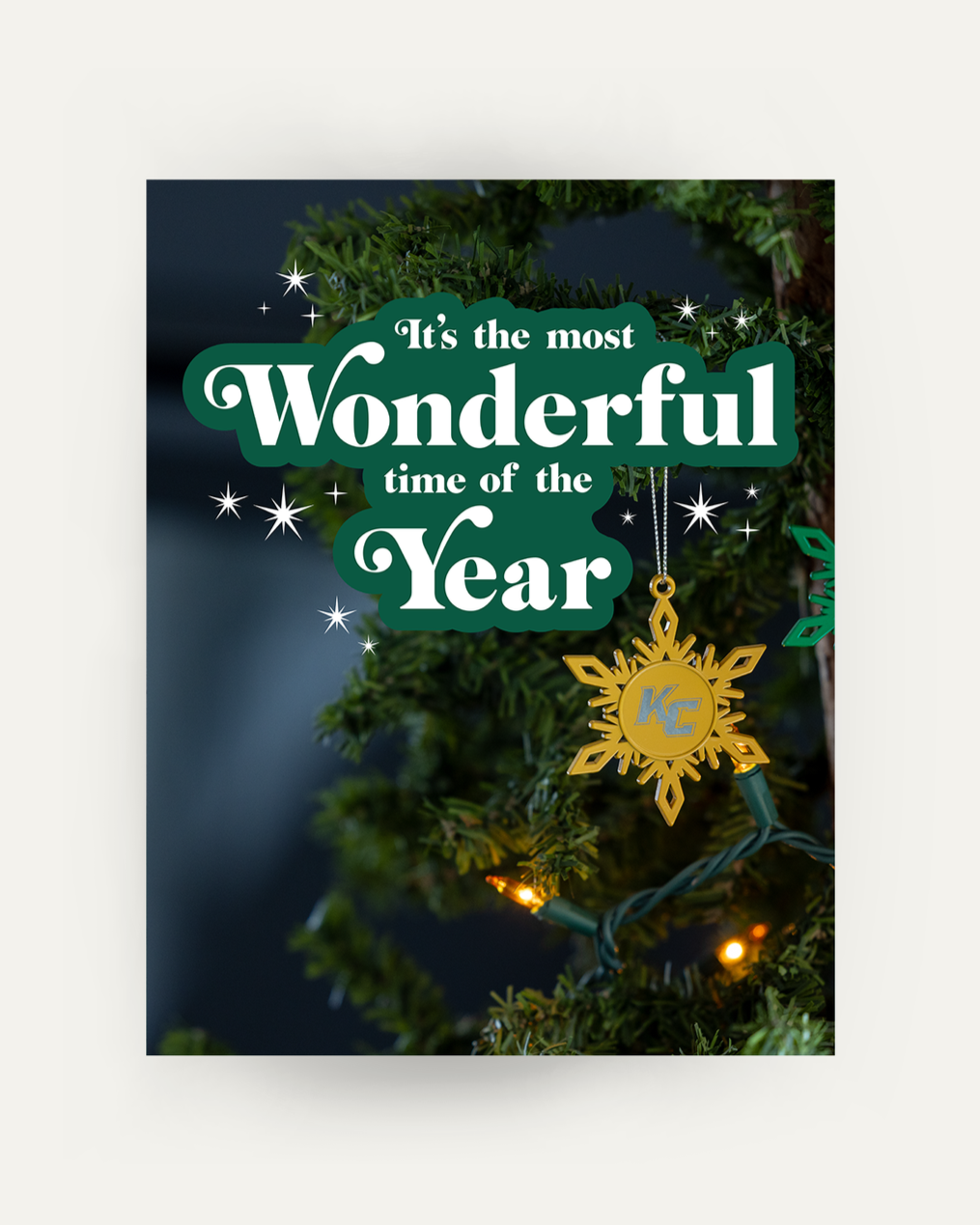 Poster of a Christmas tree with a Keuka College snowflake ornament. "It's the most Wonderful time of the Year" is overlaid on top.