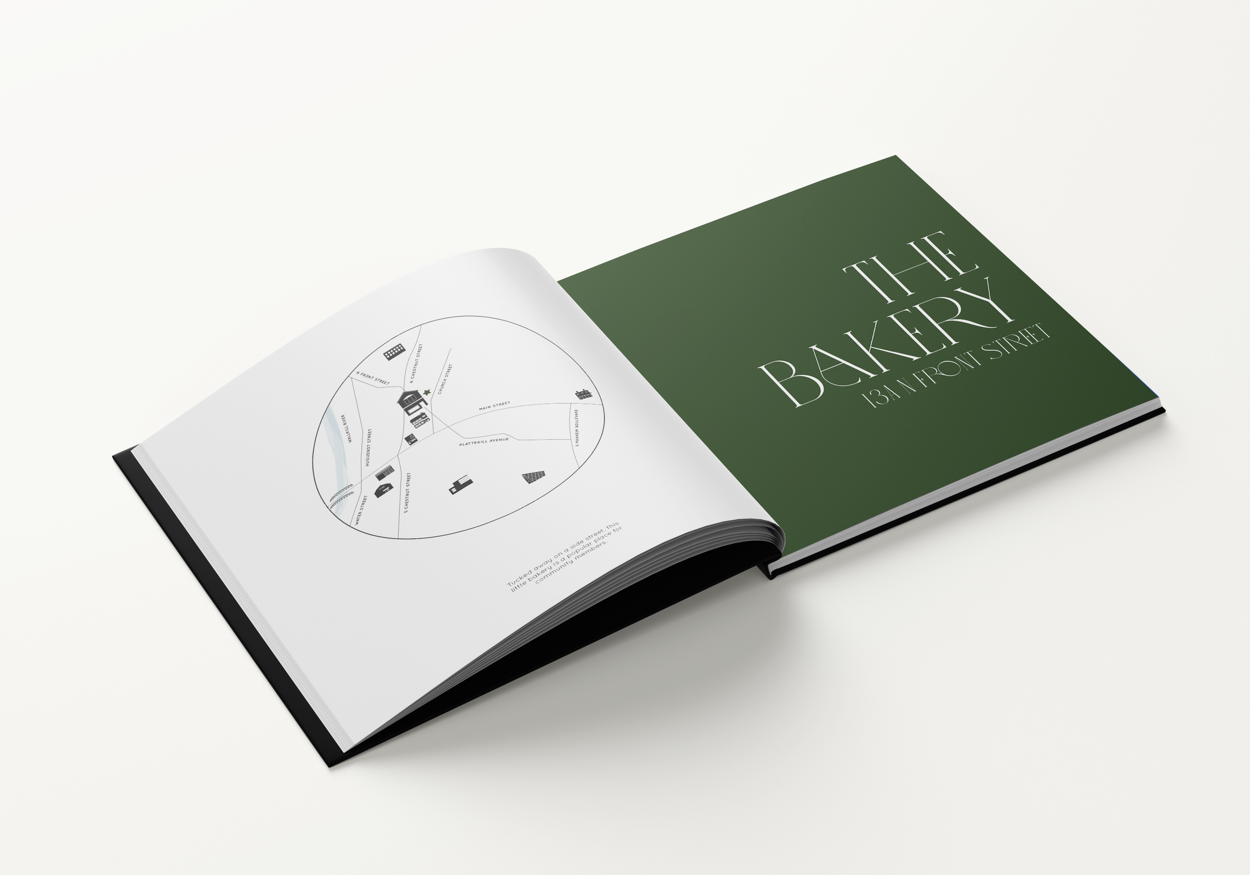 Page spread with the title "The Bakery" on the right page, and a map showing the location on the left page.