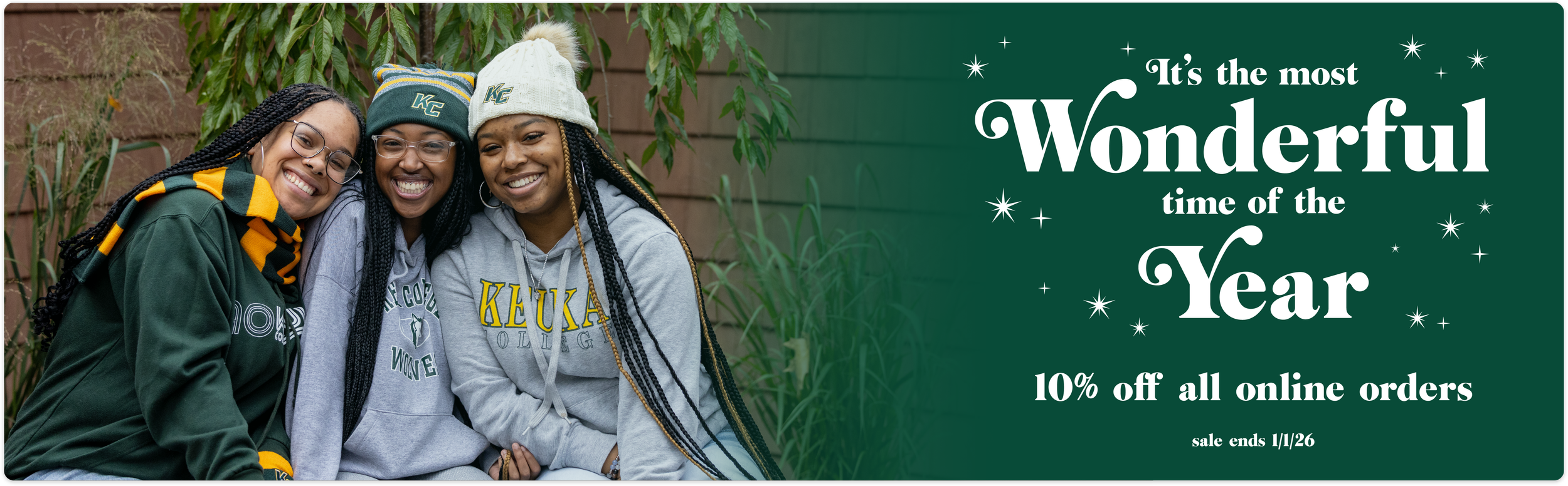 Website header advertising 10% off all online orders until January 1st 2026. It shows 3 girls dressed in Keuka College hats, scarves, and sweatshirts.