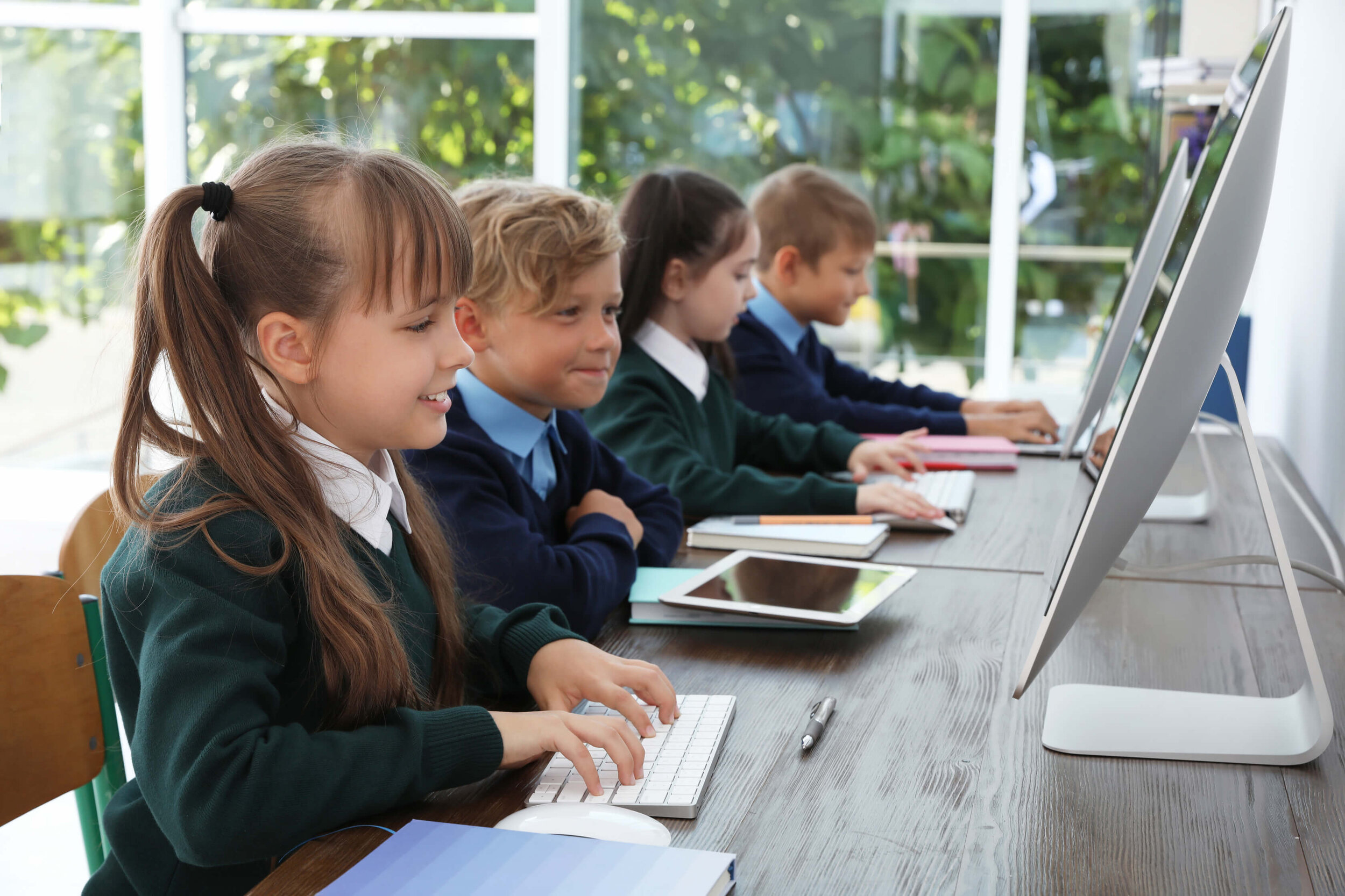 young school children on computers