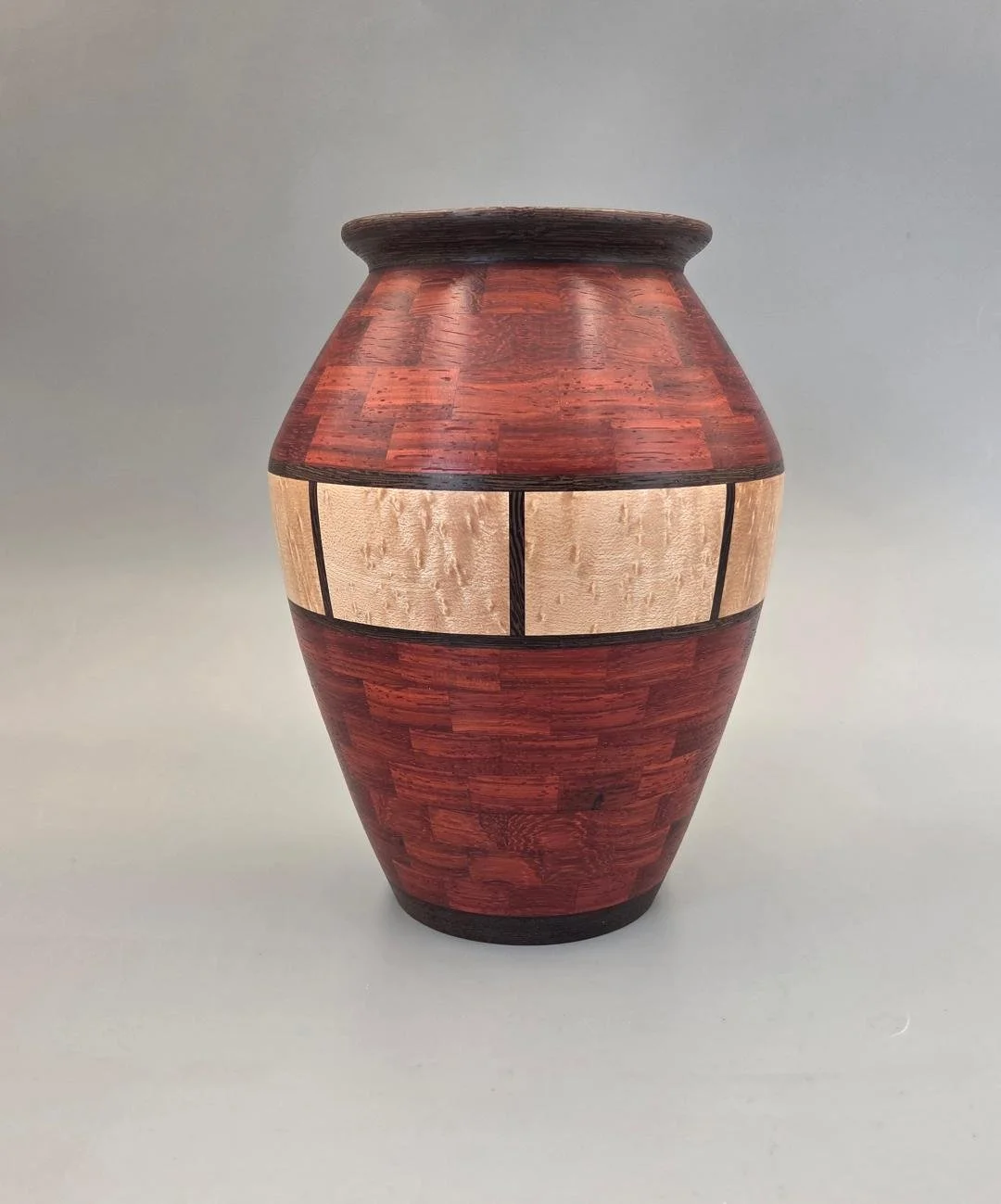 Dave Clause -- Wood vase 8.5 tall 6.5 dia wenge, birdseye maple, and pauduk.jpg