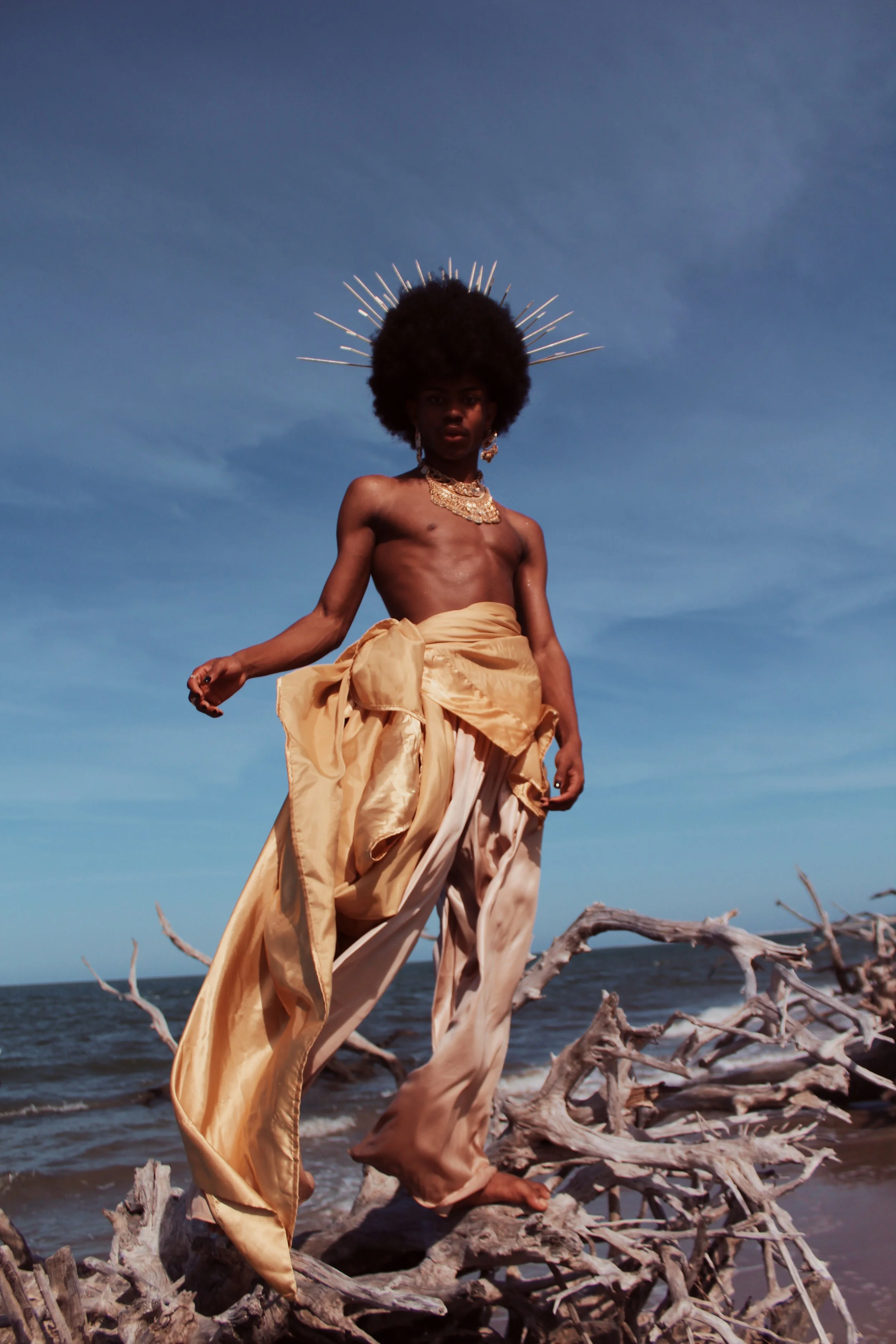 Birth of Ra - Stephen is a non-binary visual artist born and raised in Neptune Beach, Florida, whose work centers on the recreation of mythological and magical figures from spanning cultures. They chose to highlight queer youth from the east coast an