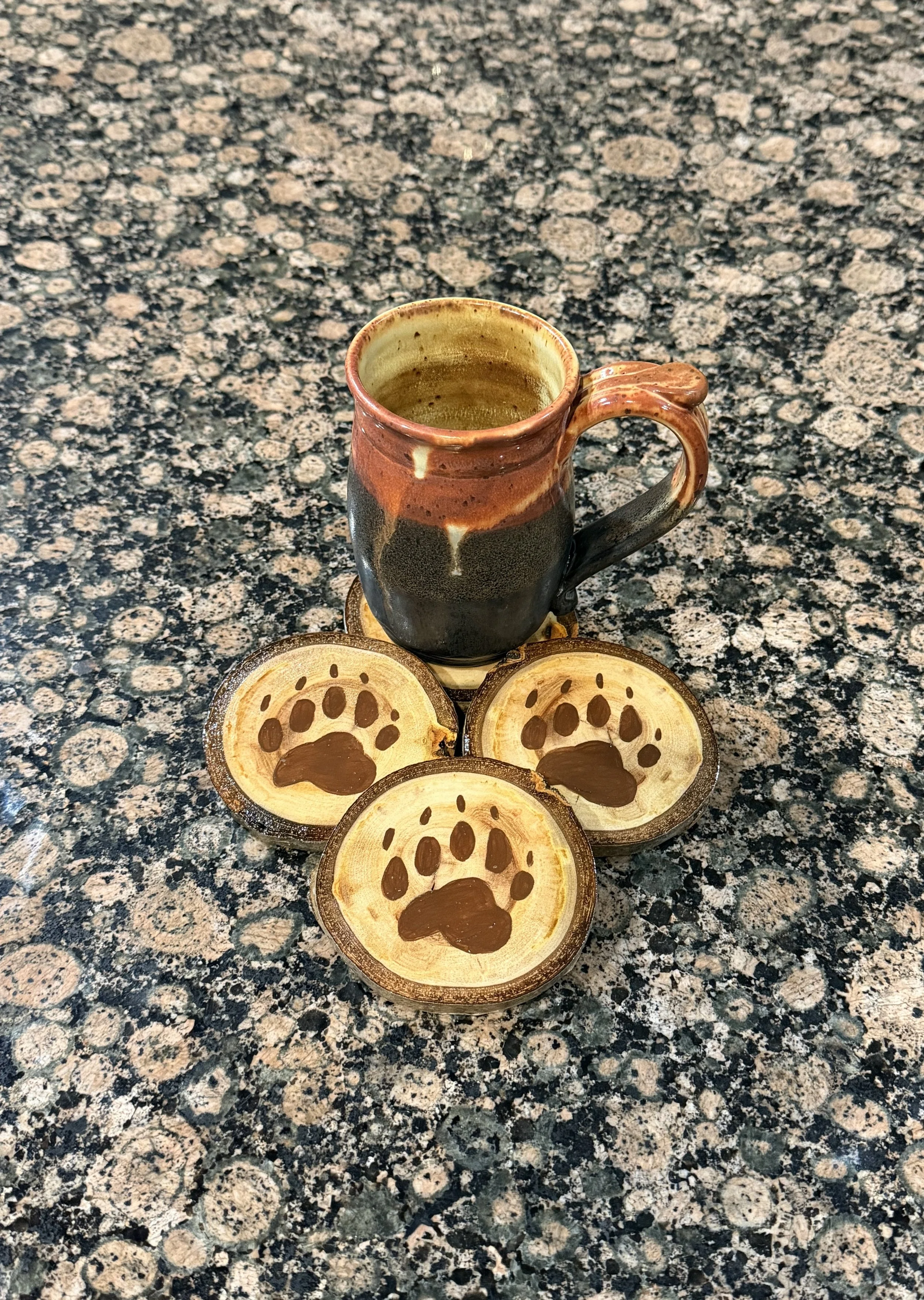 4 Piece Bear Paw Print Coaster Set on Aspen