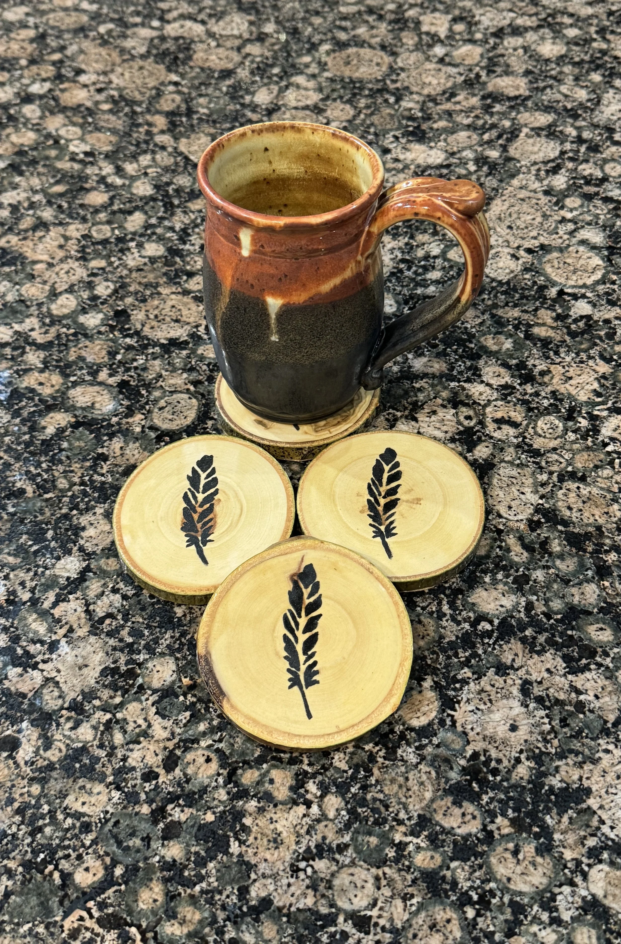 4 Piece Feather Coaster Set on Aspen