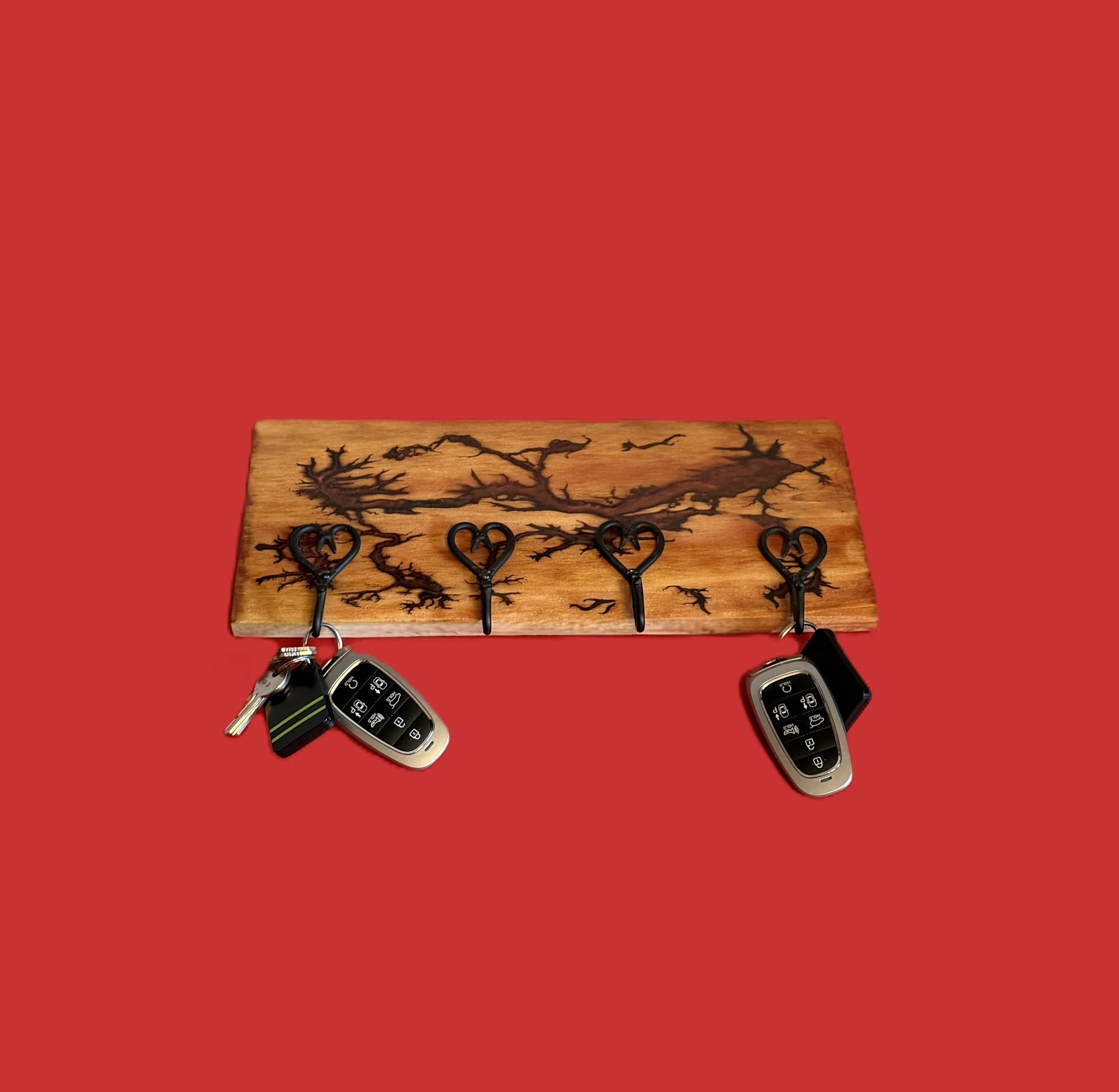 Four Black Heart Hooks on Fractural Burned Redwood with Red Epoxy Inserts