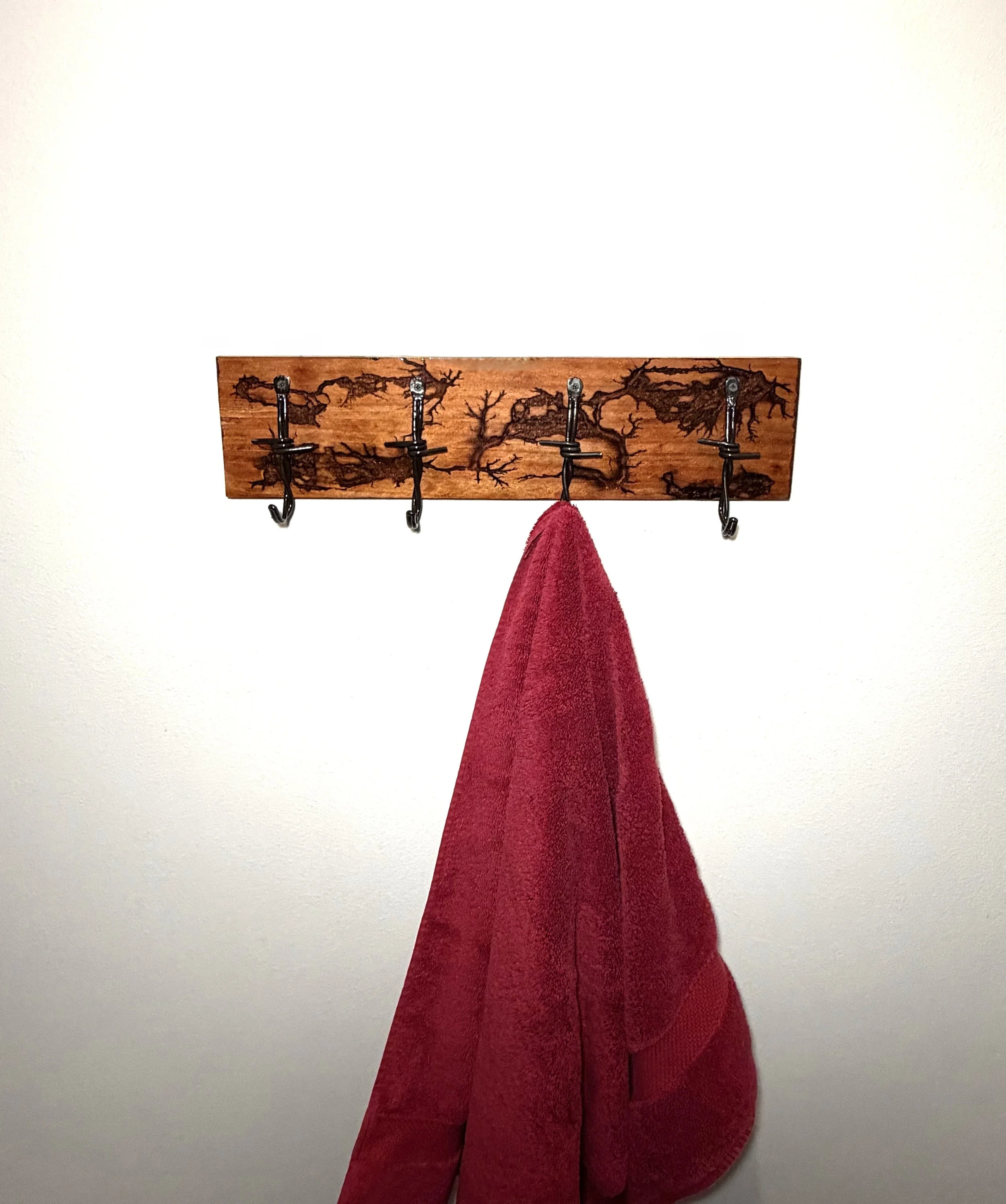 Four Barbwire Hooks on Fractural Burned Redwood with Red Epoxy Inserts