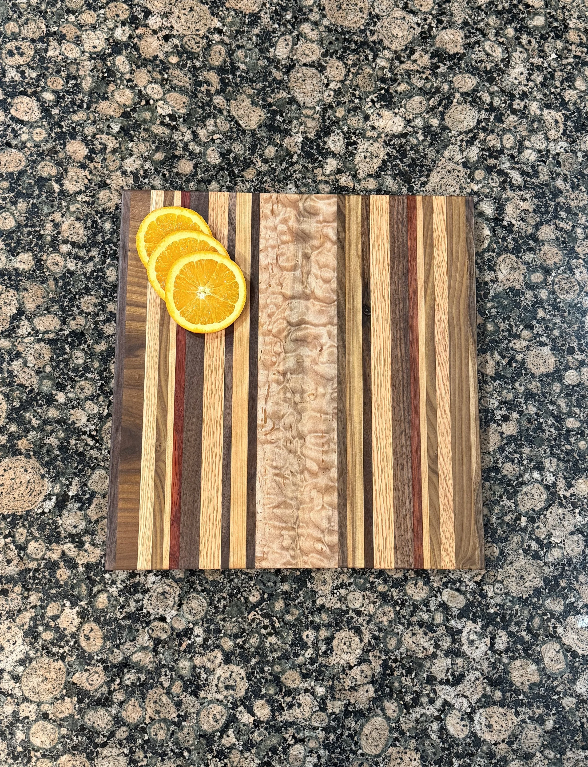 Exotic Padauk, Curly Maple, Oak, Cherry, Russian Olive and Walnut Cutting/Charcuterie Board