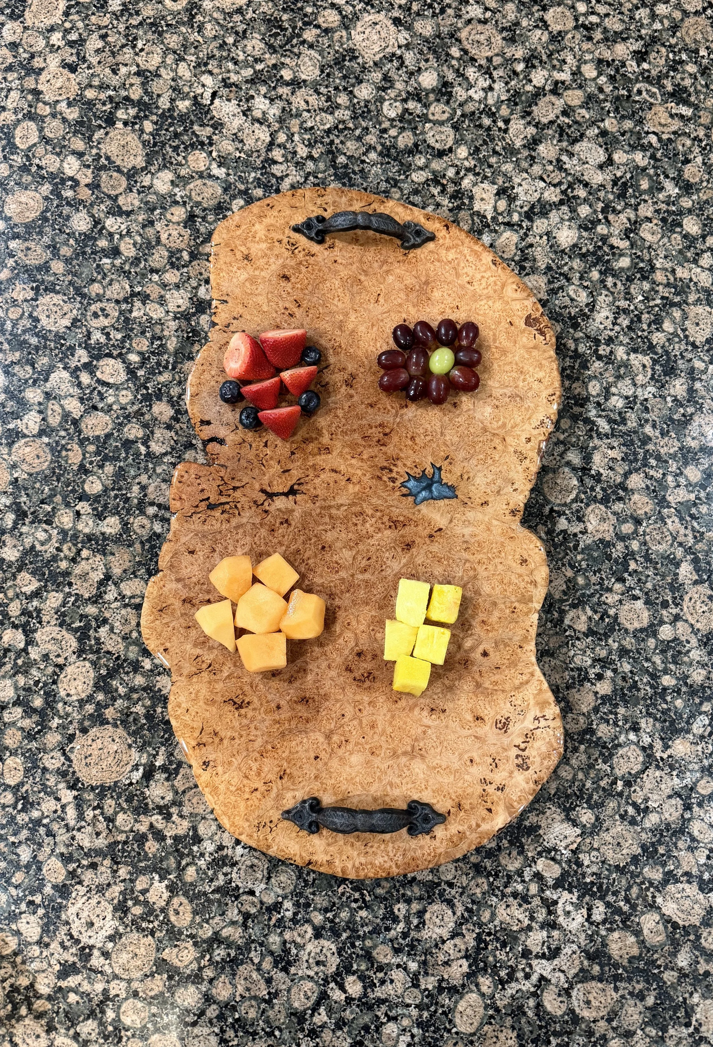 Live Edge Birdseye Maple Charcuterie Board with Blue Epoxy Insert and Brown Leaf Design Handles