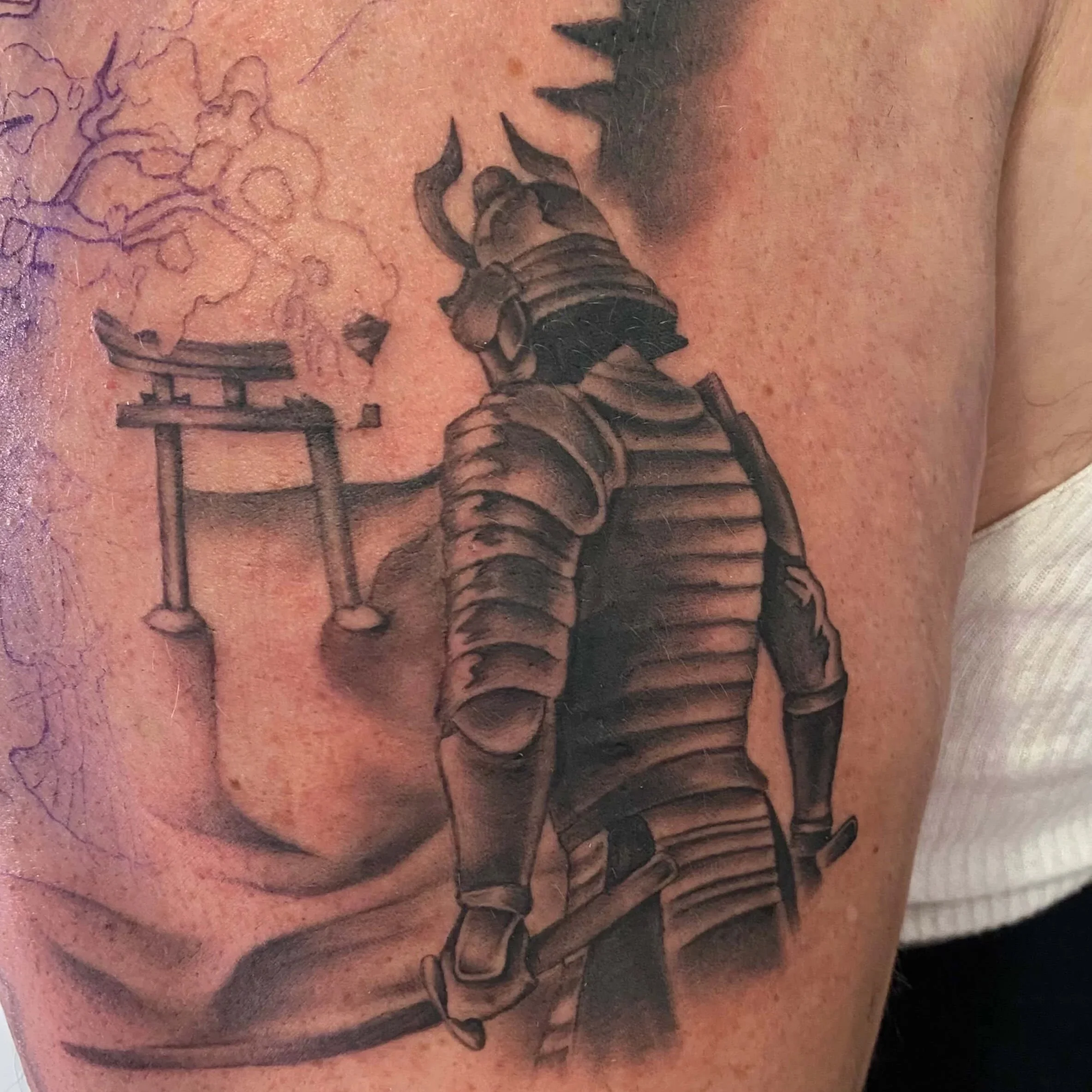 Black and gray realism tattoo of Samurai in full battle armor done by Erin Peterson in Denton Texas.