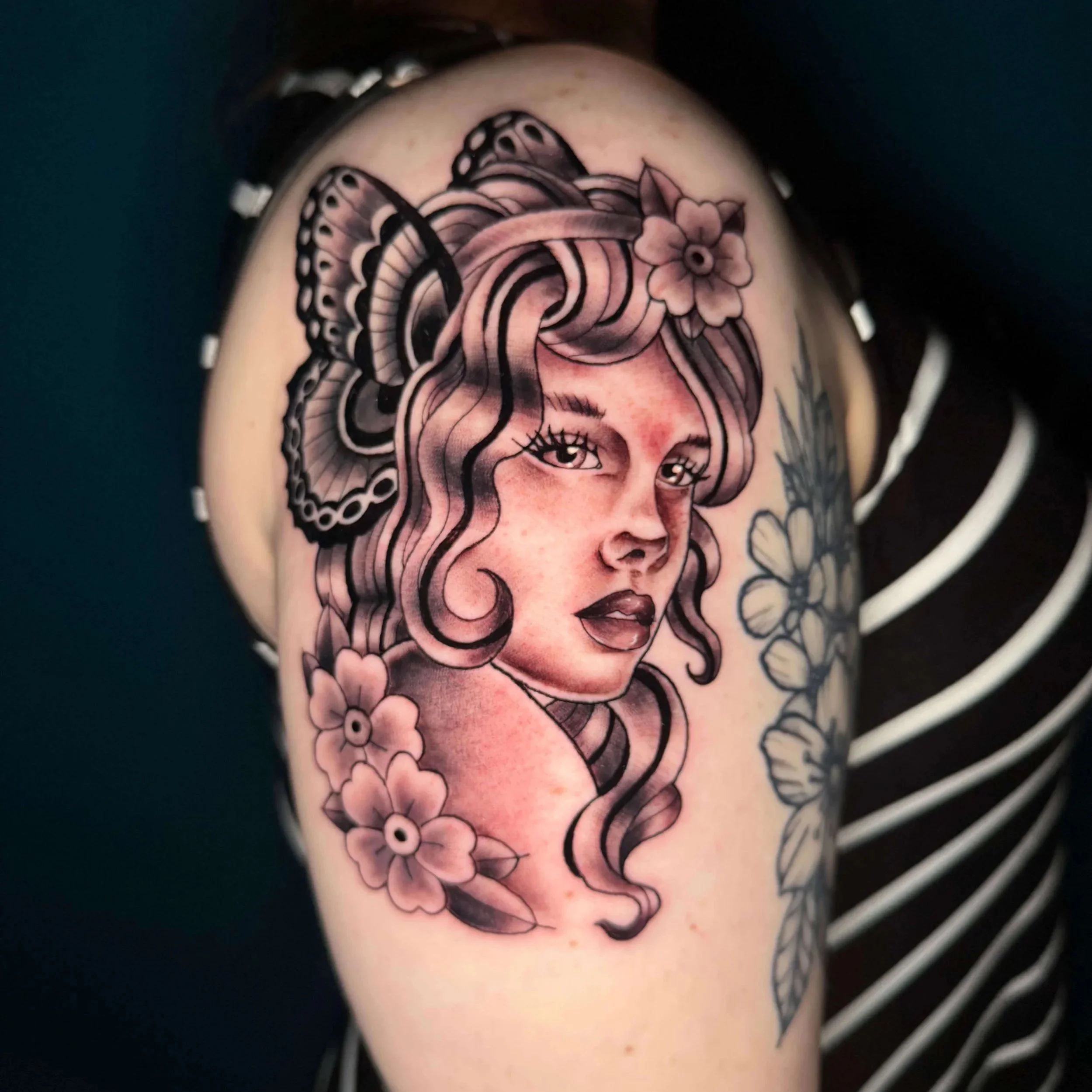 Neo Traditional woman portrait shoulder tattoo with butterfly wings by Erin Peterson at Integrity Tattoo in Denton.