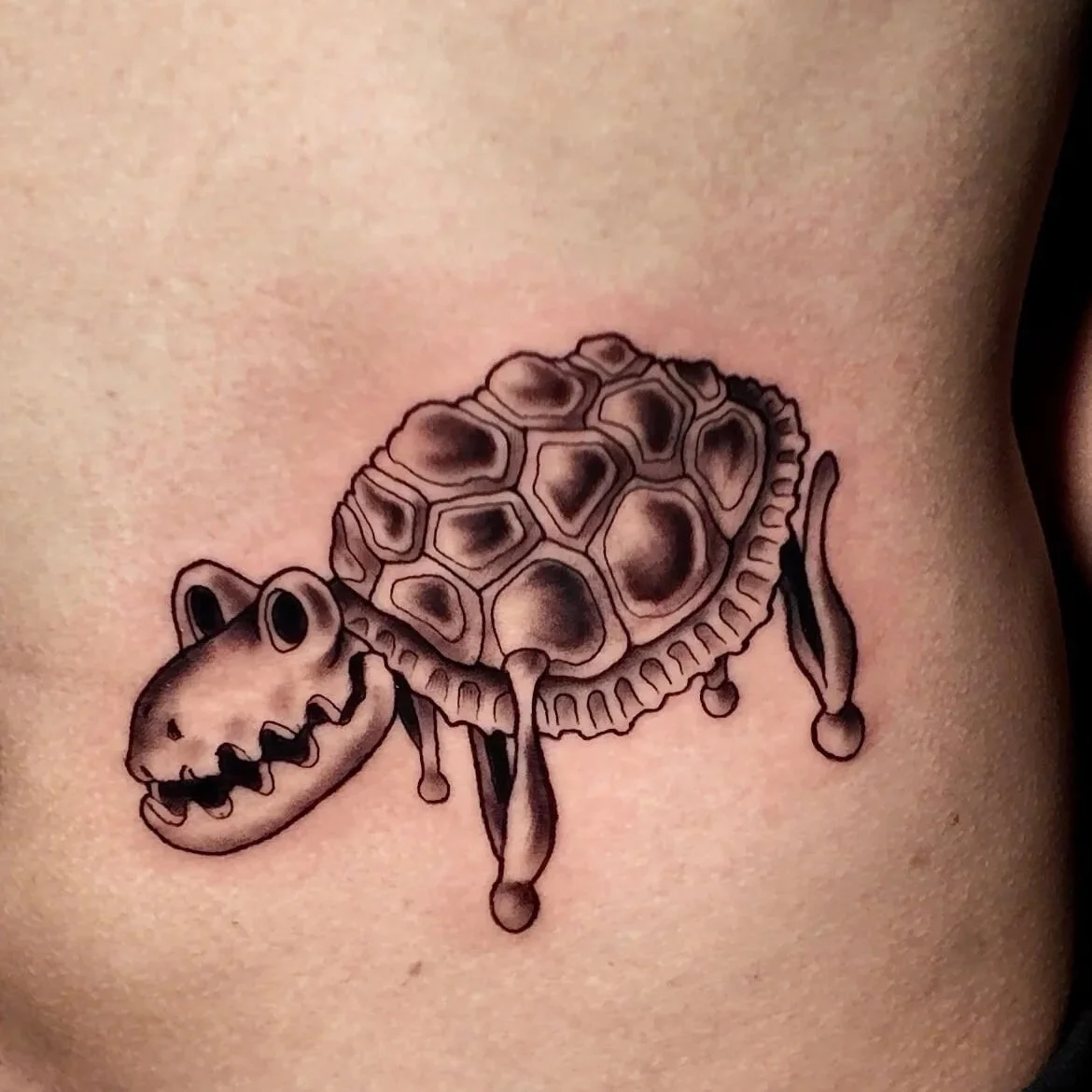 Illustrative Coraline skeleton turtle by Erin Peterson at Integrity Tattoo in Denton Texas.