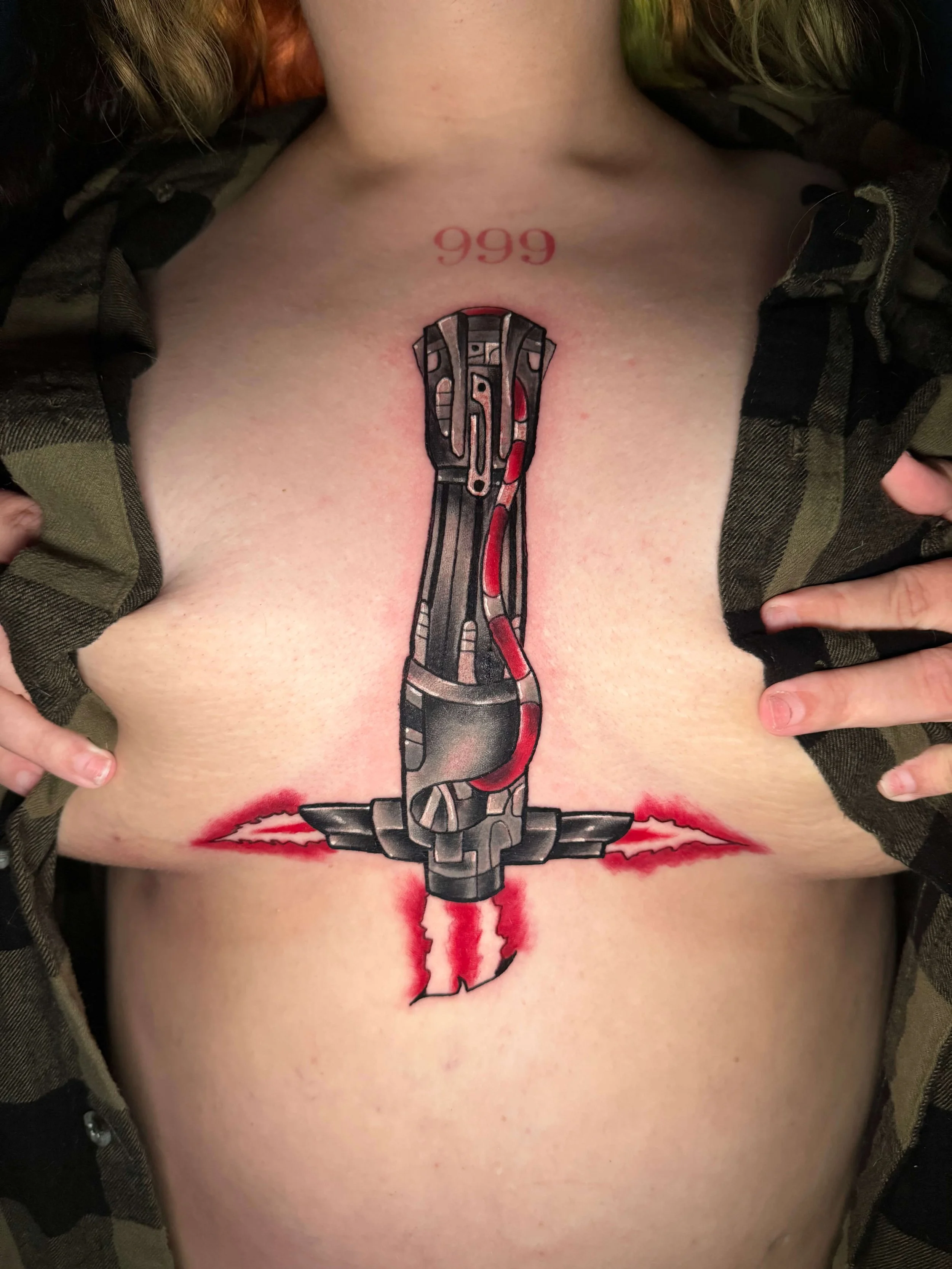 Kyle Ren lightsaber sternum tattoo by Erin Peterson at Integrity Tattoo in Denton Texas.
