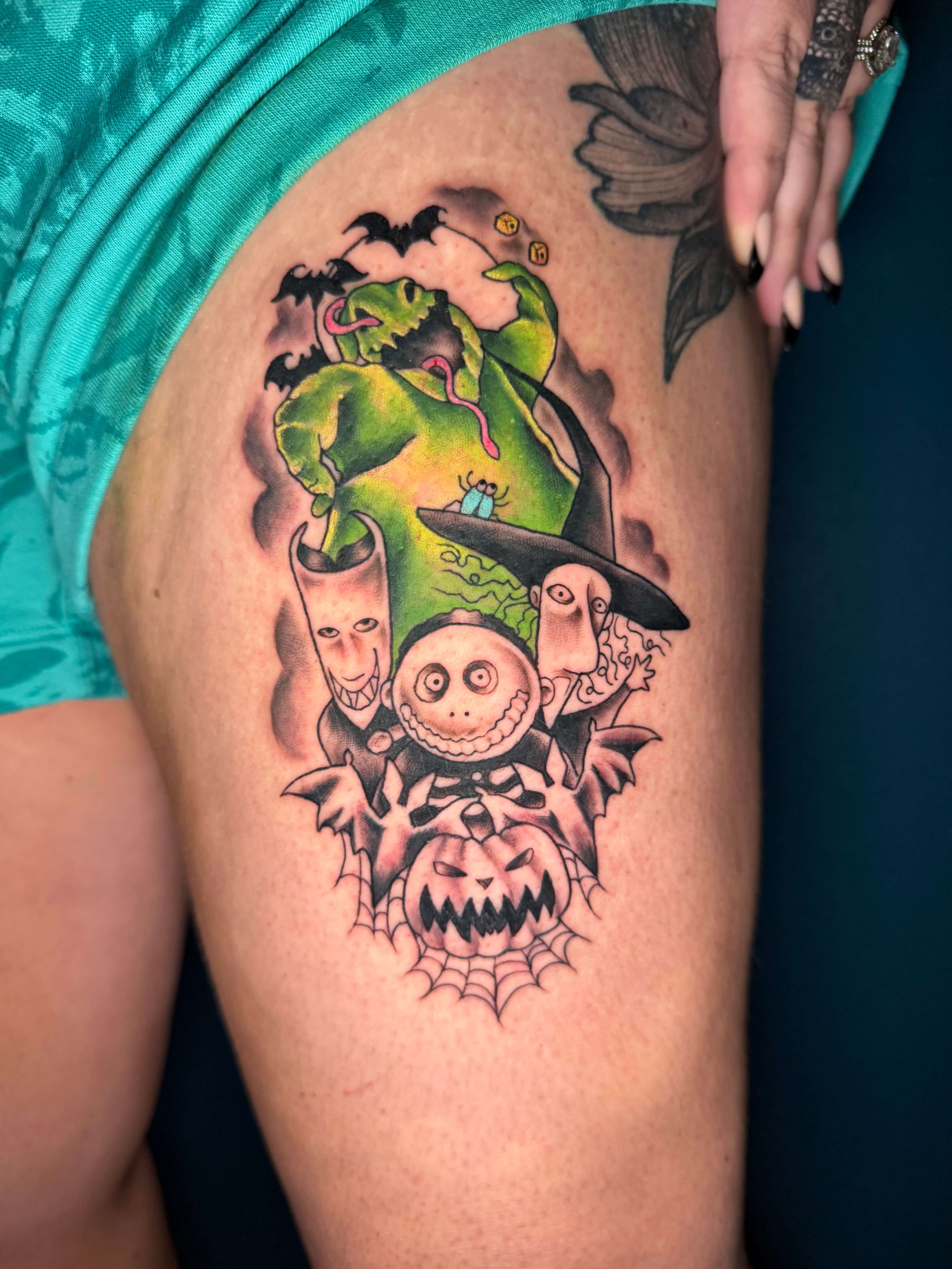 Nightmare Before Christmas Oogie Boogie and henchmen tattoo by Erin Peterson at Integrity Tattoo in Denton Texas.