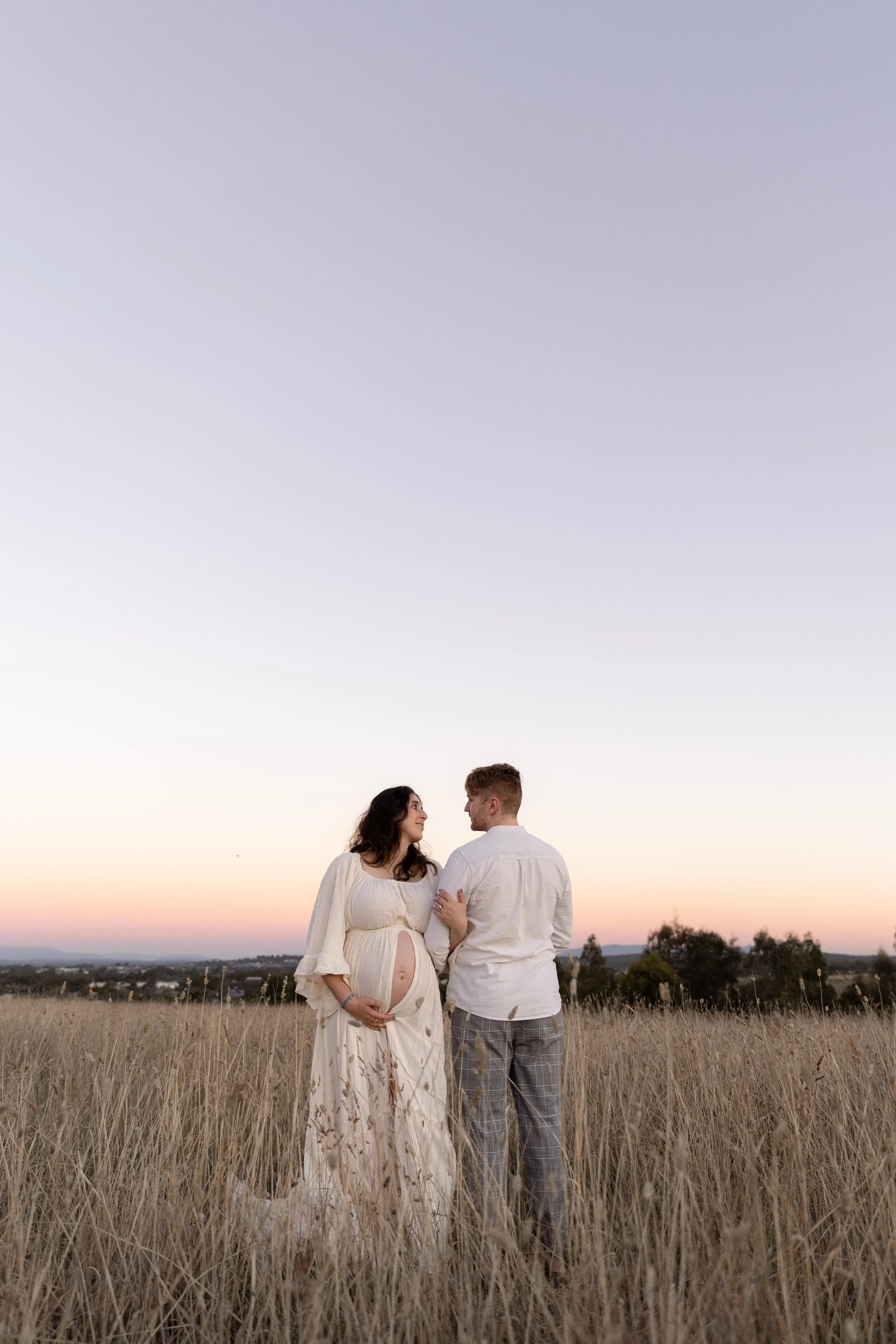 A soulful connection between expecting parents captured during a peaceful sunset maternity photography session in Melbourne.