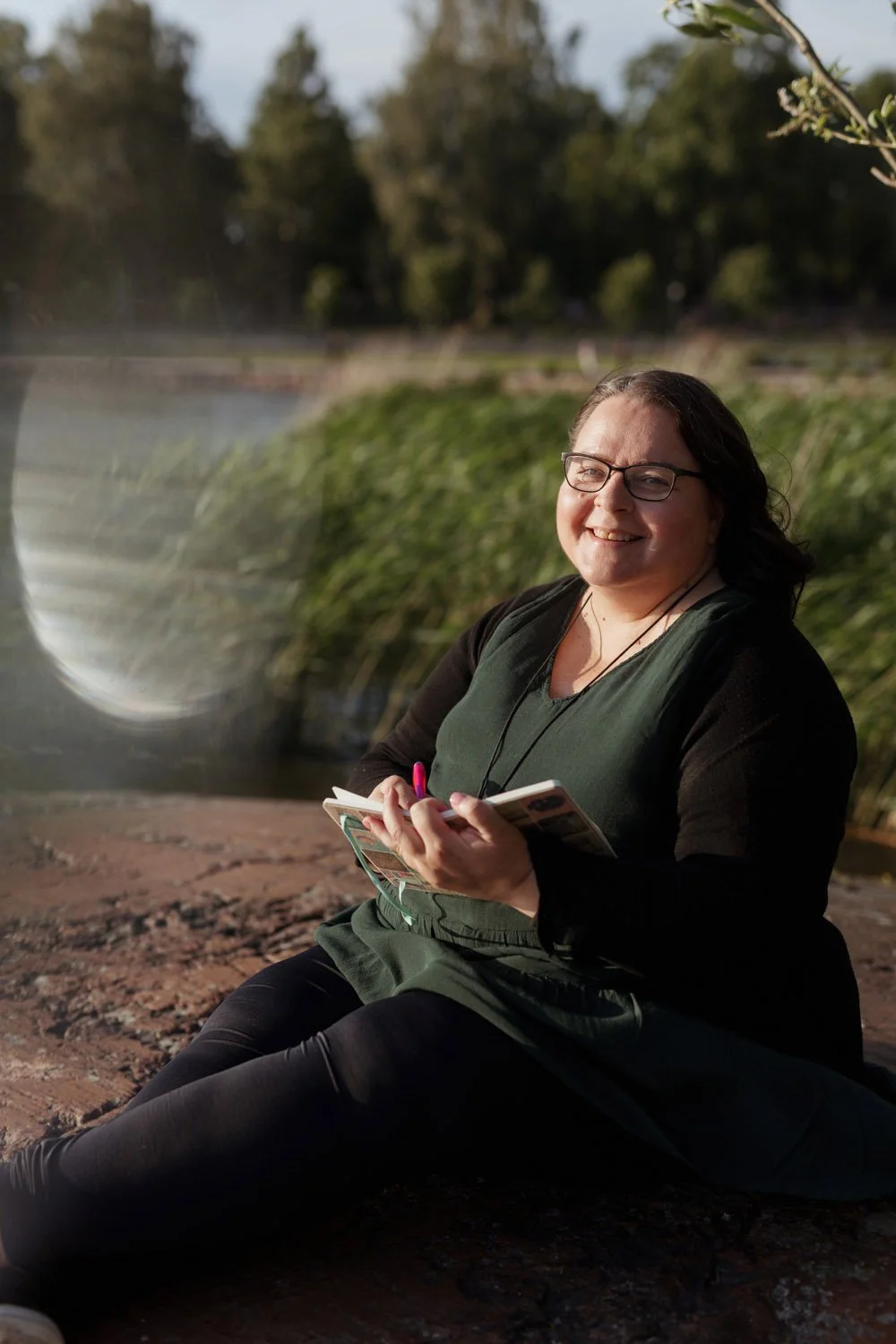 Annamari Typpö, the spokesperson, writes in her notebook and smiles.