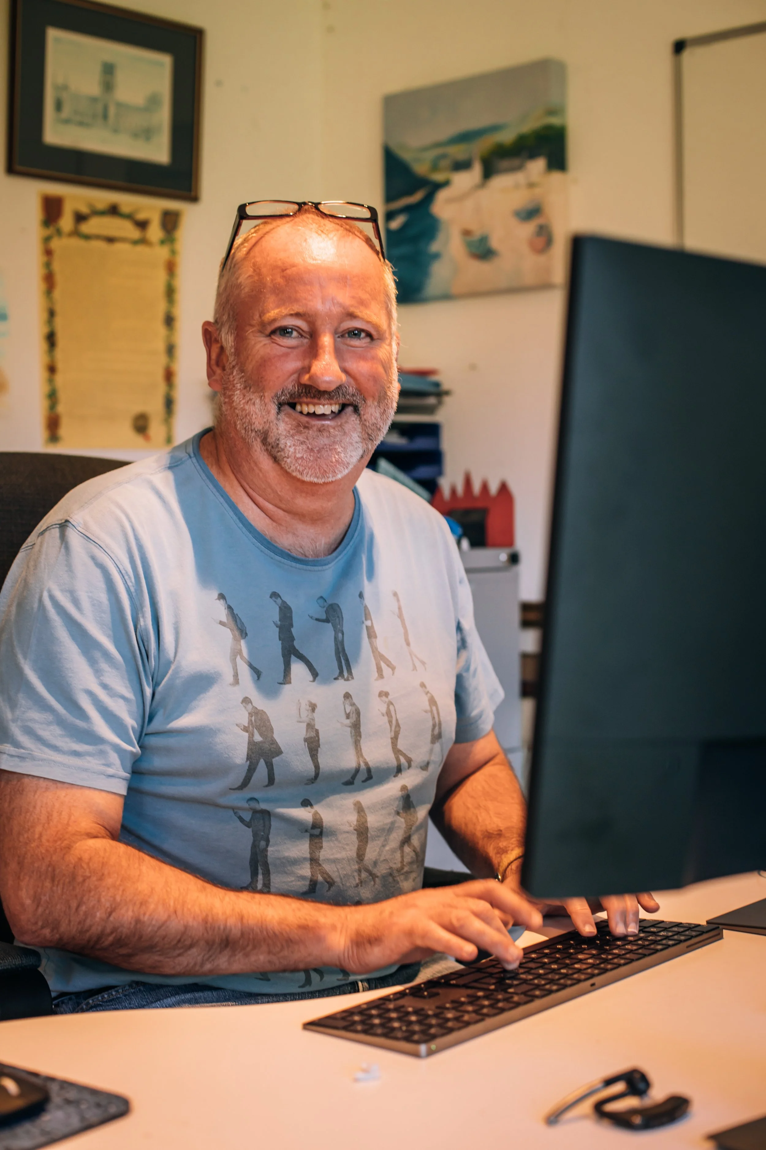 Neil Francis working at his desk, available for CEO and AI governance advisory conversations