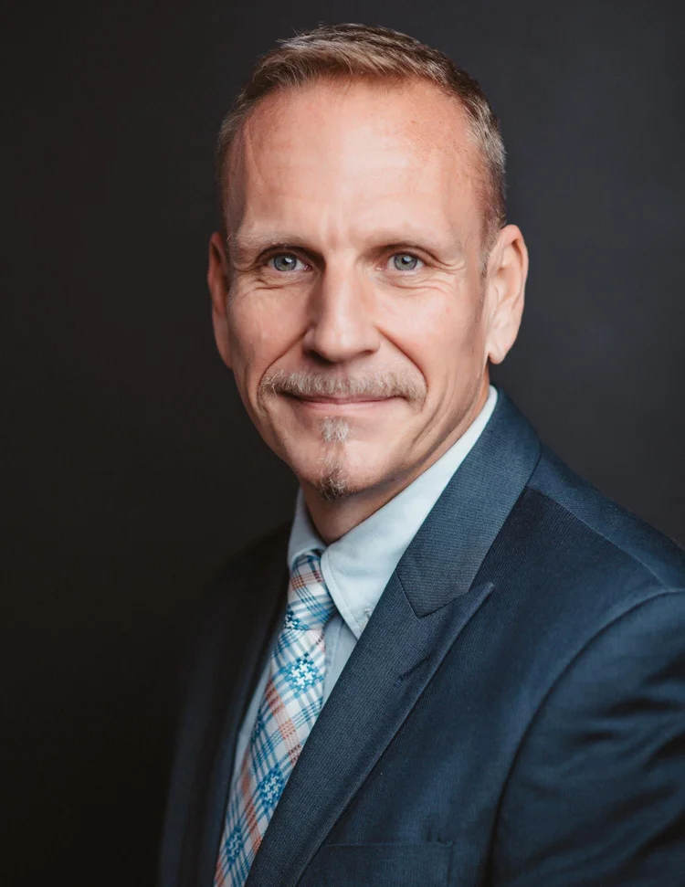 Executive portrait, dark background