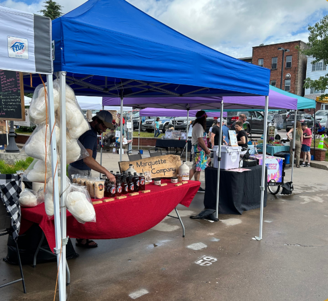Marquette Maple Co.'s merchandise and market stand.