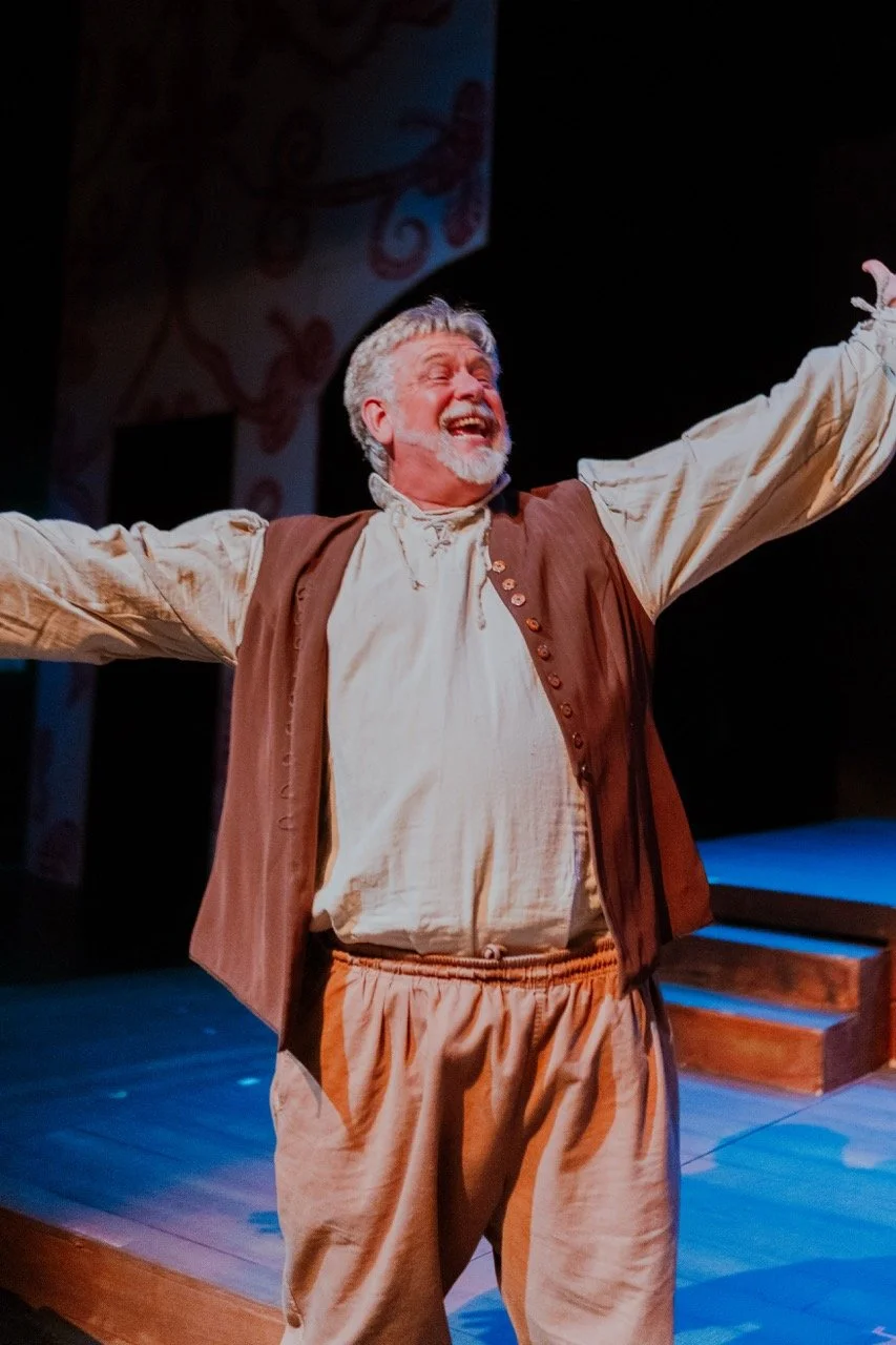 Actor in historical costume performing on stage