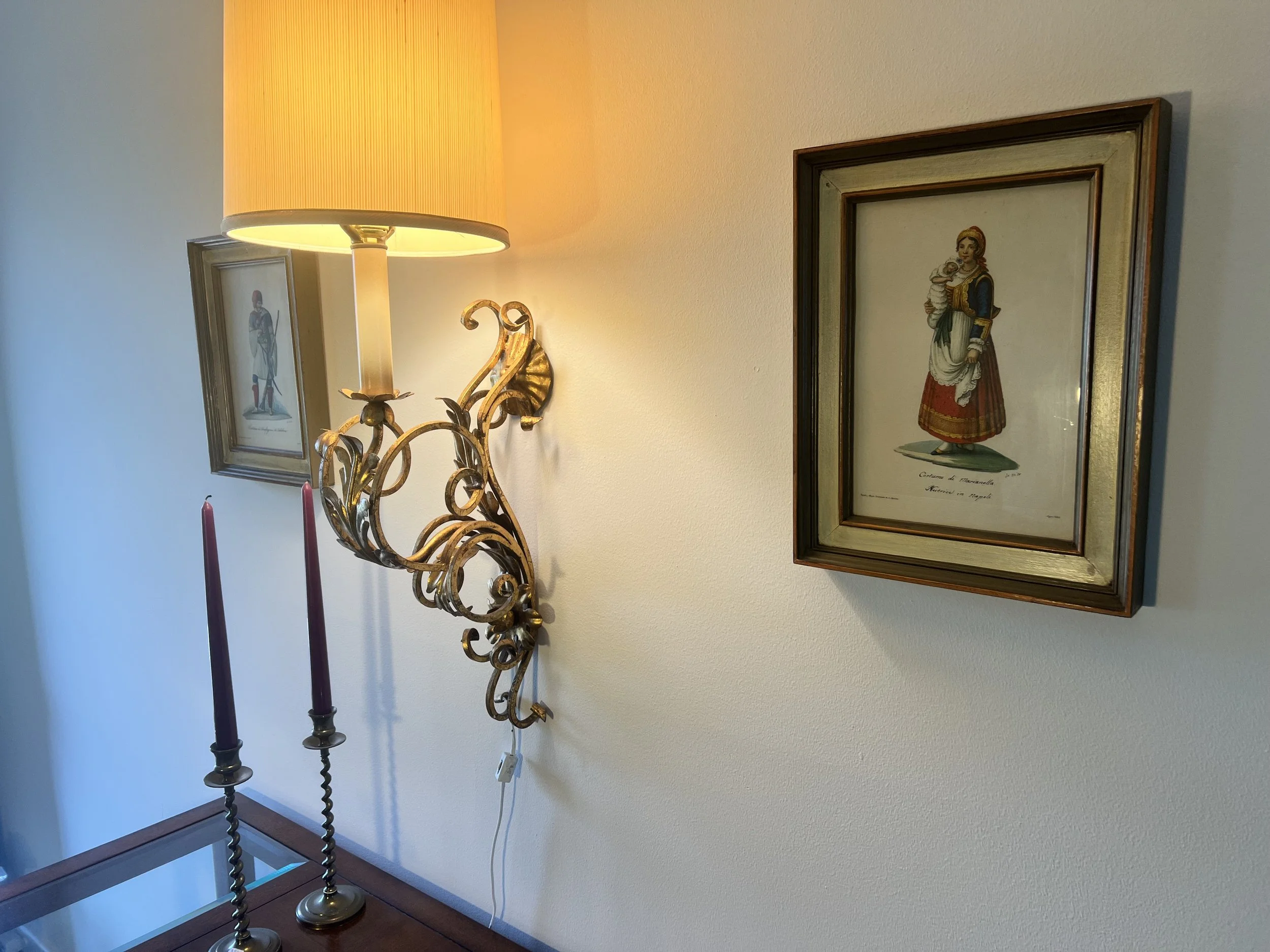 Ornate Victorian Bacchus gold-gilt mirror with an integrated triple candle sconce